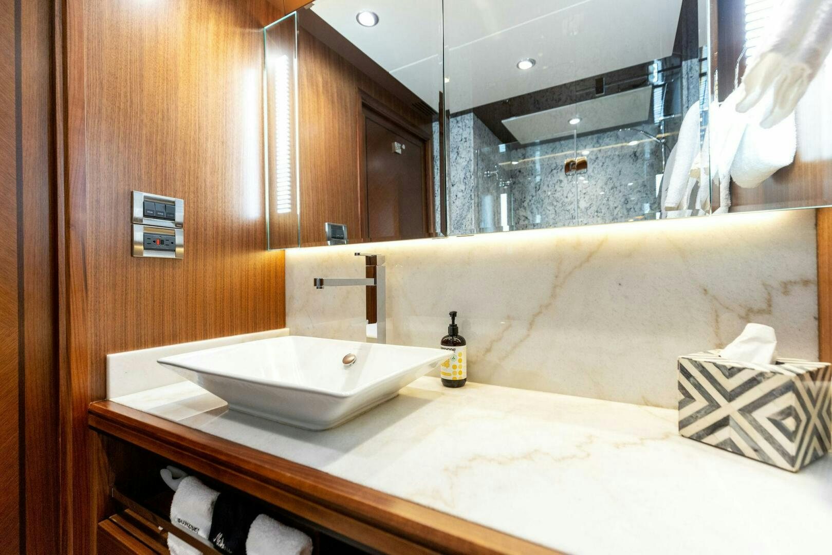 a bathroom with a sink and a bathtub aboard SUNZSET Yacht for Sale