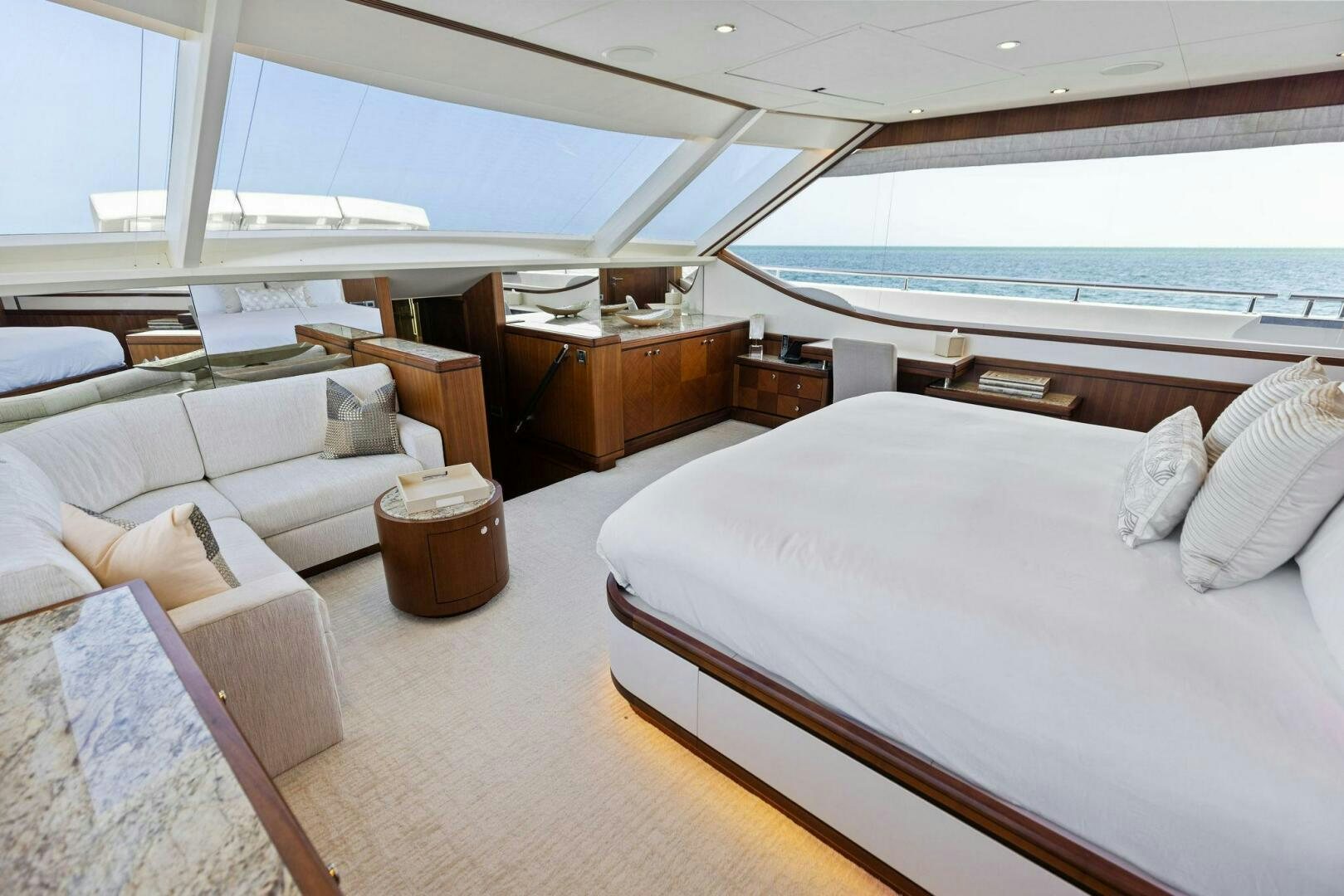a room with a bed and a table aboard SUNZSET Yacht for Sale