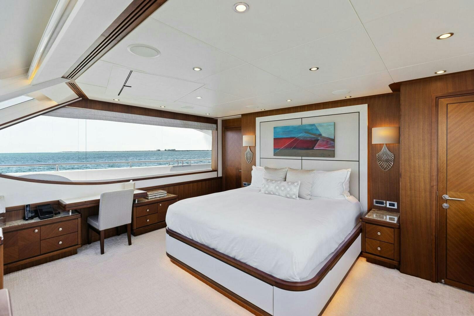 a large bedroom with a large bed aboard SUNZSET Yacht for Sale