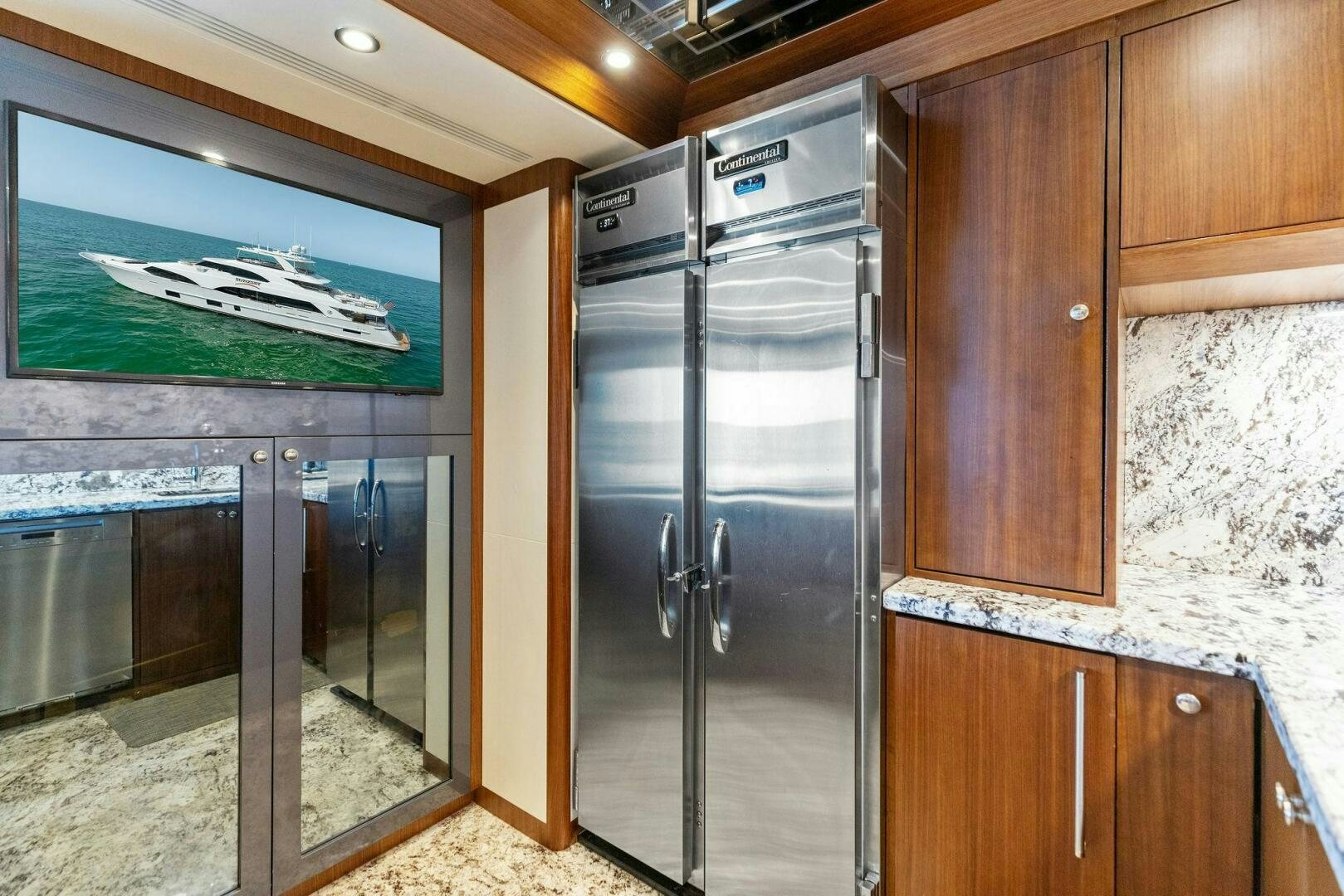a kitchen with a refrigerator aboard SUNZSET Yacht for Sale
