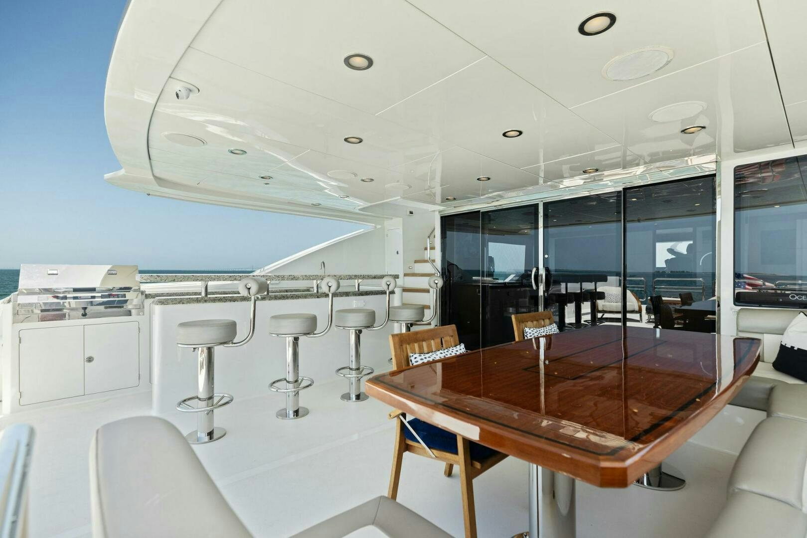a room with tables and chairs aboard SUNZSET Yacht for Sale