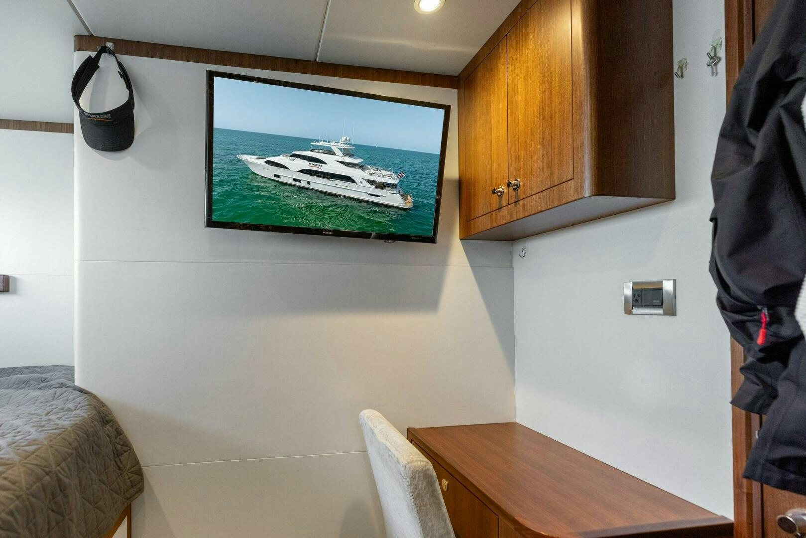a television on a wall aboard SUNZSET Yacht for Sale