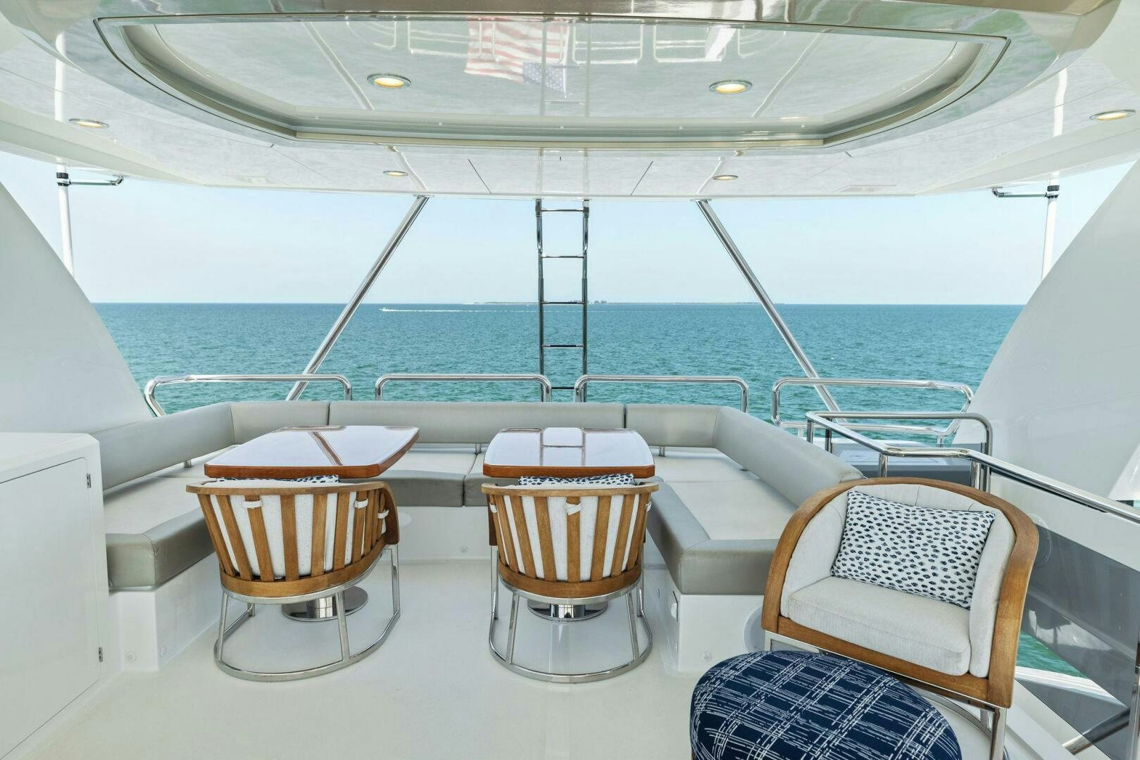 a room with chairs and a table aboard SUNZSET Yacht for Sale