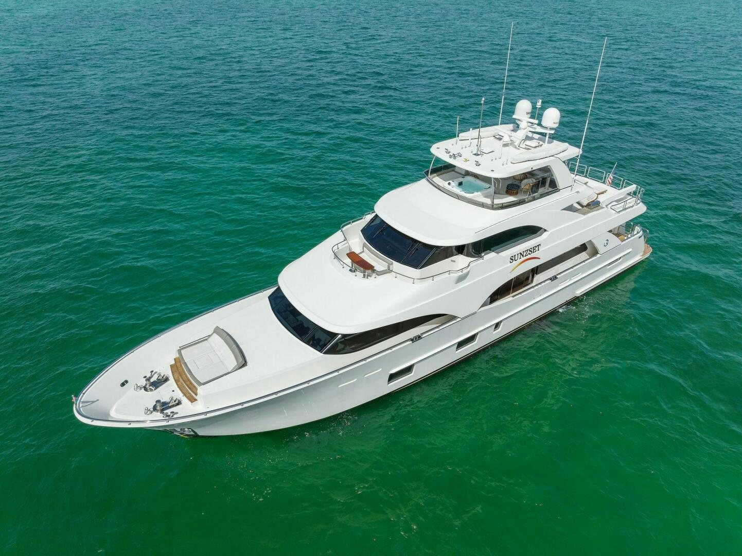 a white boat in the water aboard SUNZSET Yacht for Sale