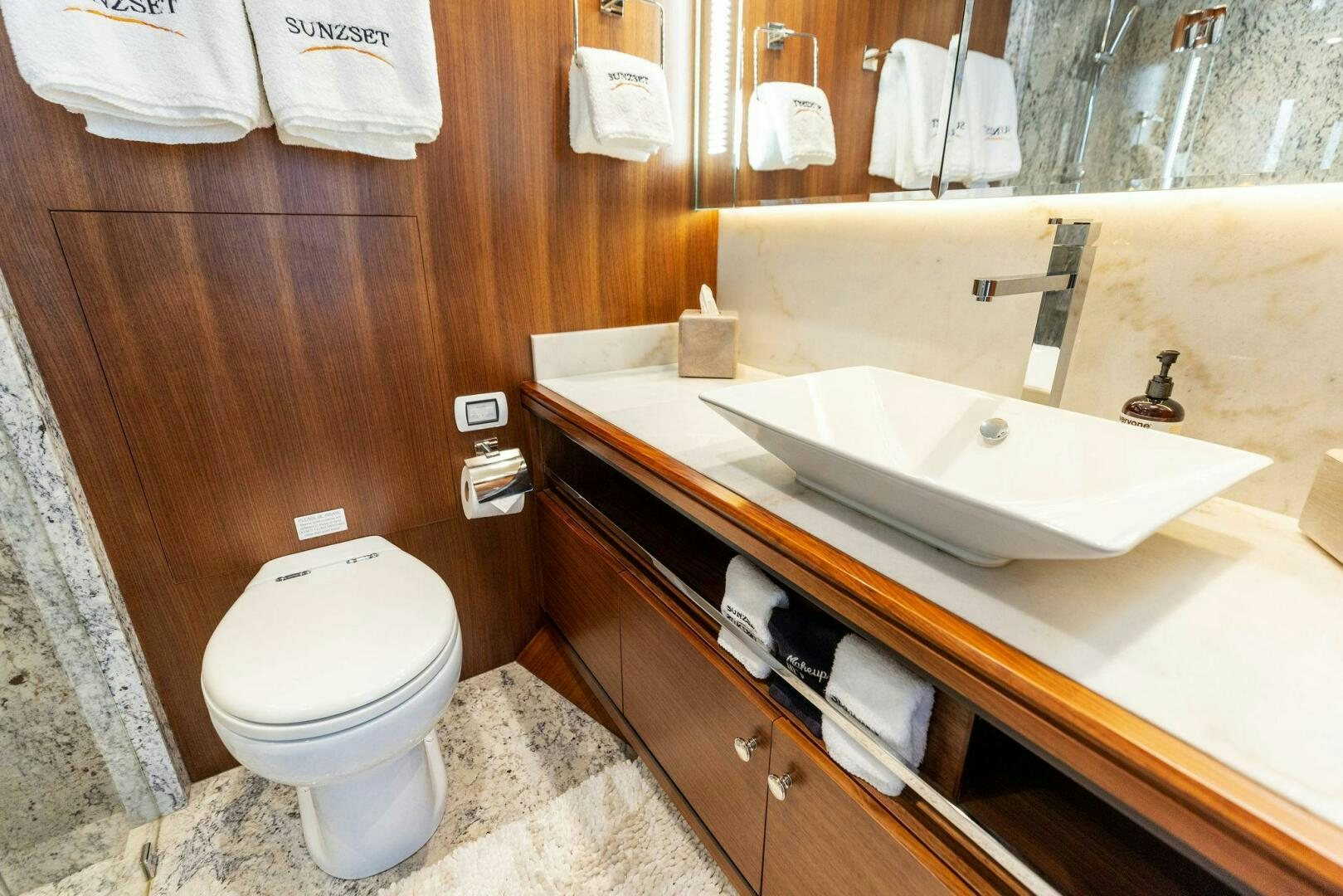 a bathroom with a sink and toilet aboard SUNZSET Yacht for Sale