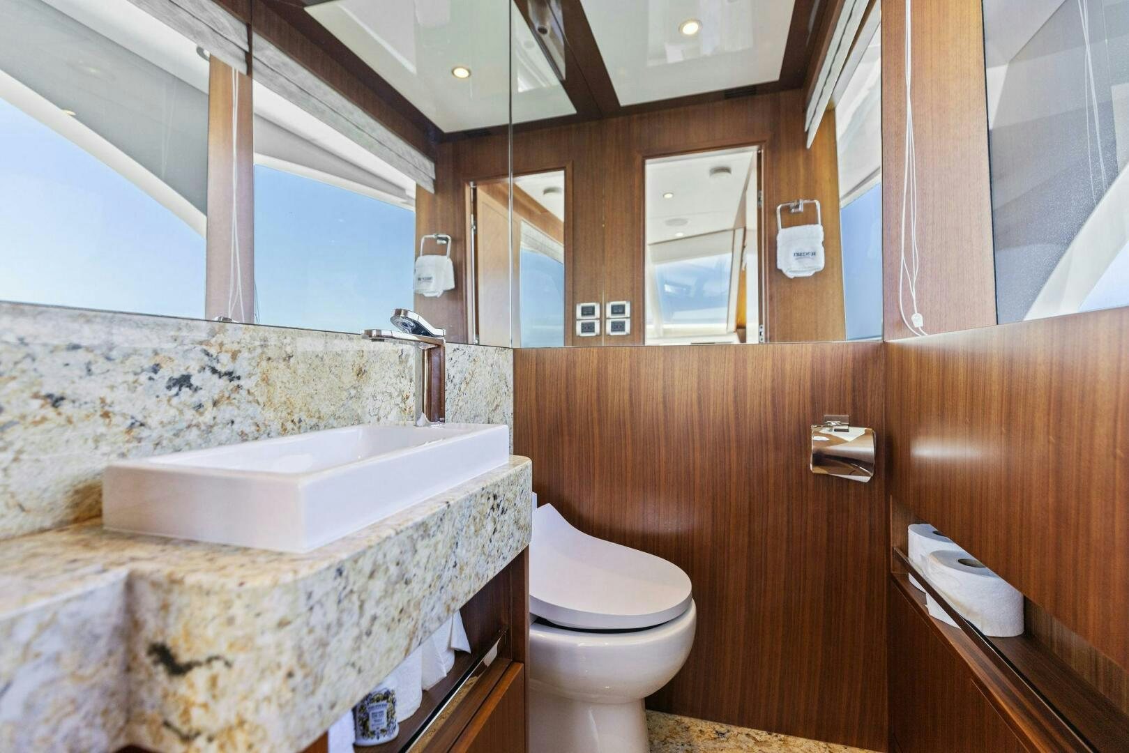 a bathroom with a tub sink and toilet aboard SUNZSET Yacht for Sale
