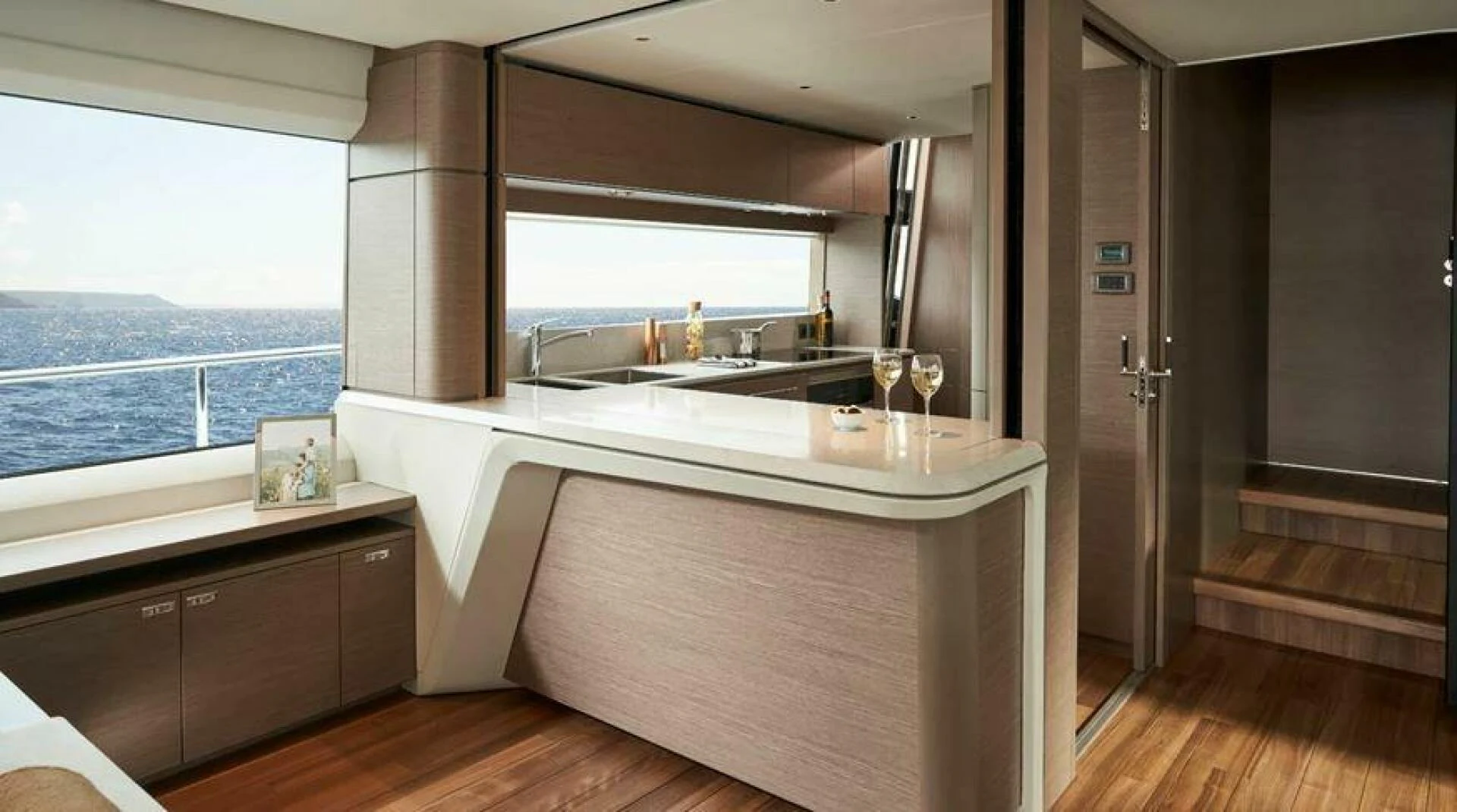 a kitchen with a large window aboard SIDURI III Yacht for Sale