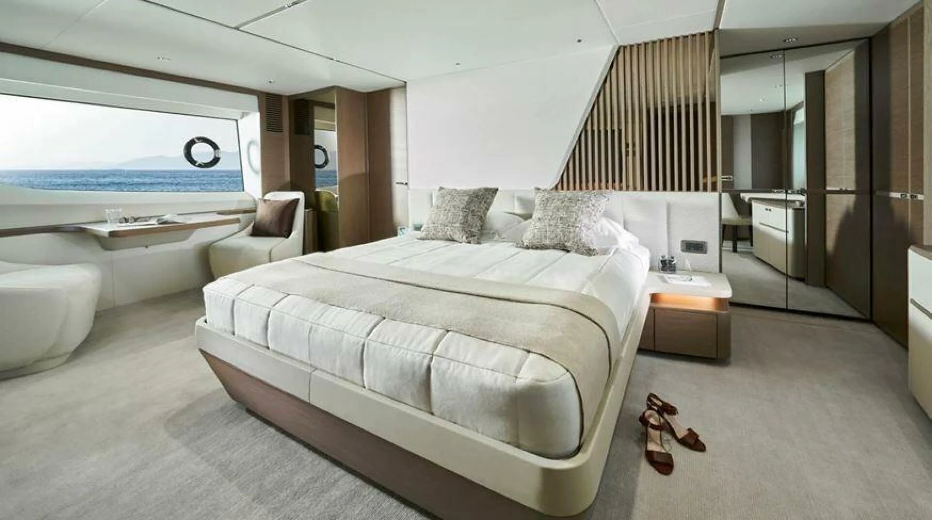 a bedroom with a large bed aboard SIDURI III Yacht for Sale