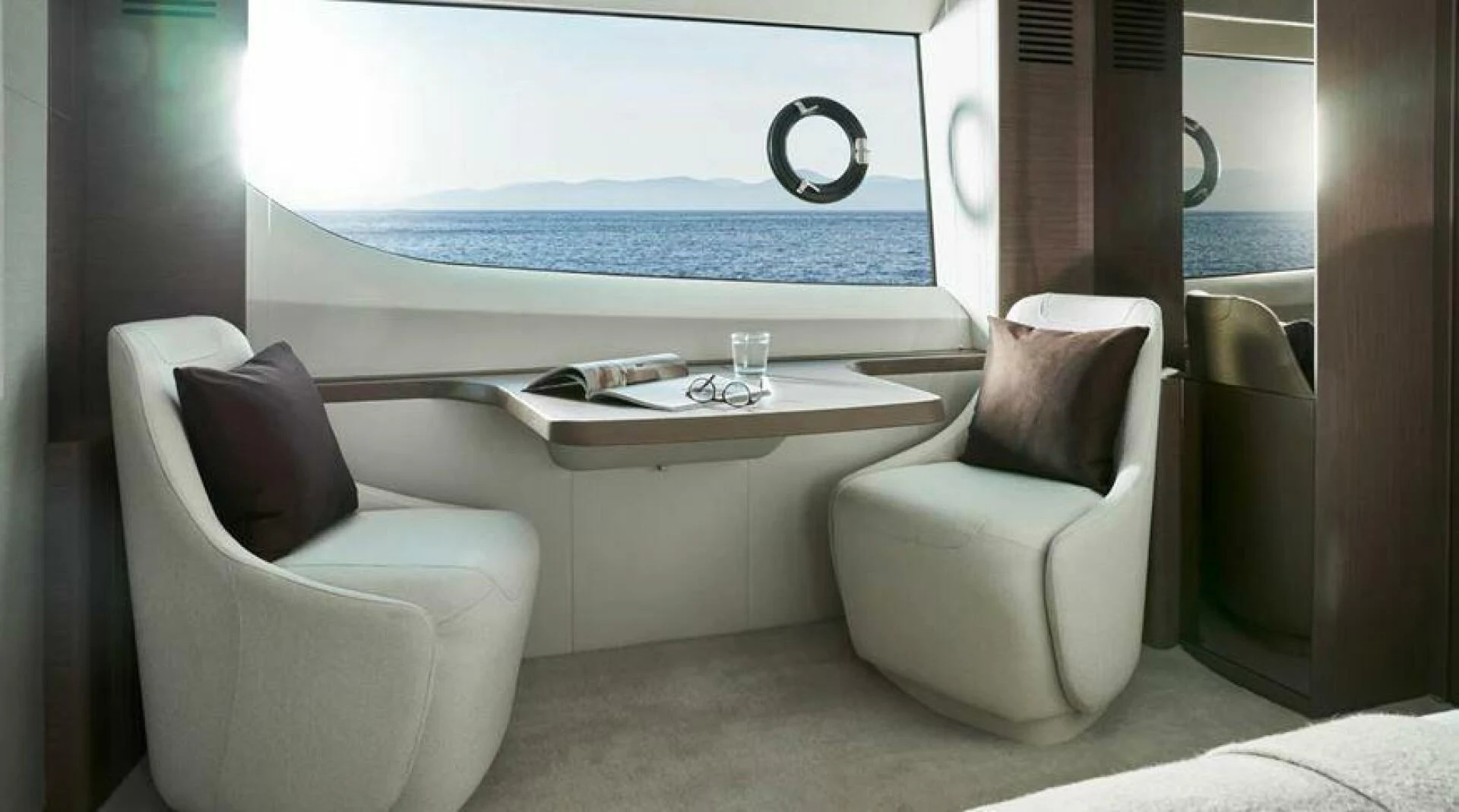a room with a table and chairs aboard SIDURI III Yacht for Sale