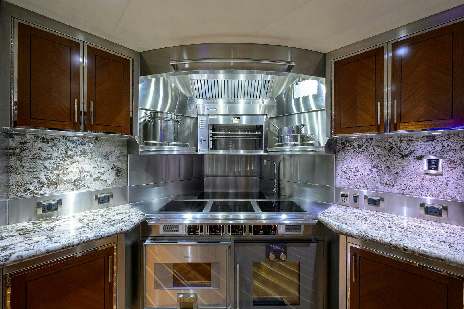 a kitchen with a stainless steel stove aboard SARABETH Yacht for Sale