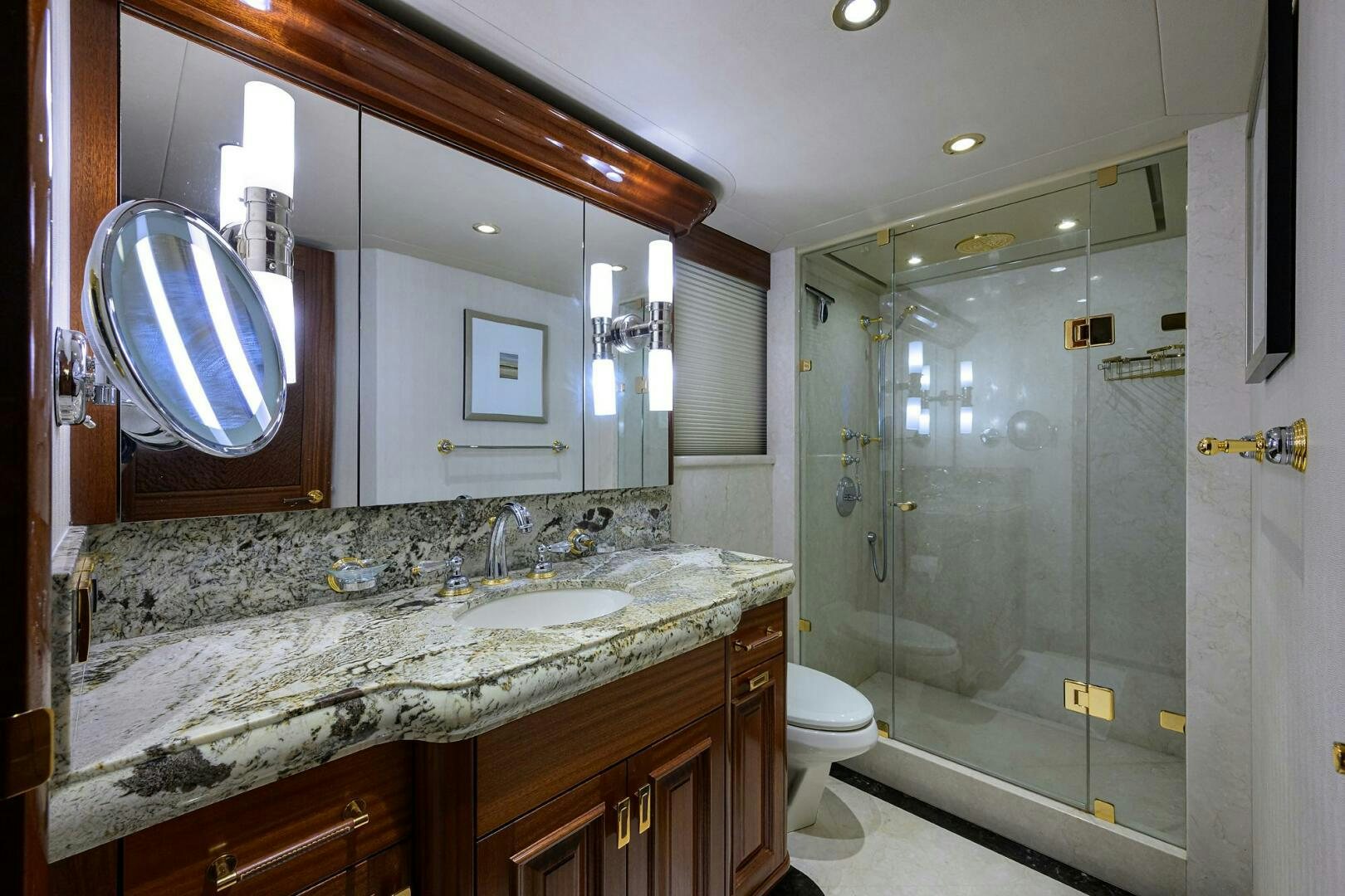 a bathroom with a large mirror aboard SARABETH Yacht for Sale