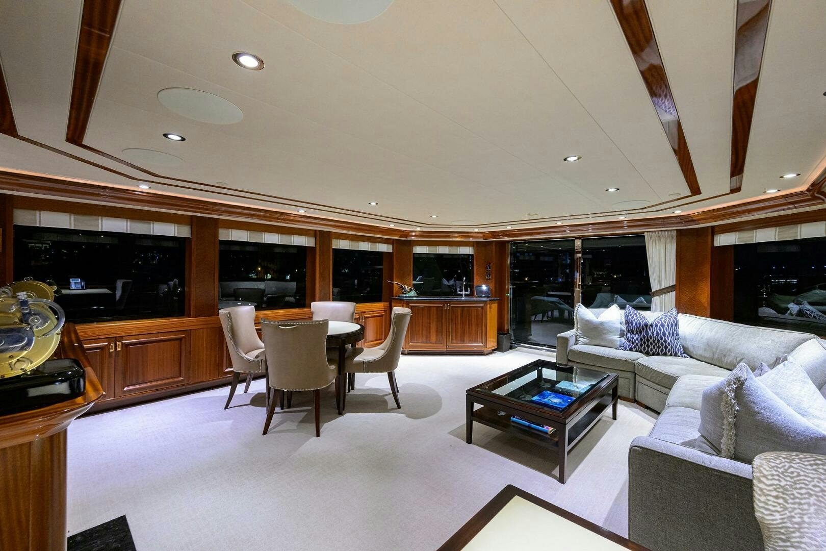 a living room with a large open kitchen and dining area aboard SARABETH Yacht for Sale
