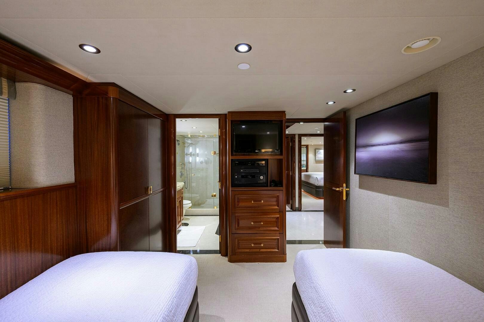 a room with a bed and a television aboard SARABETH Yacht for Sale