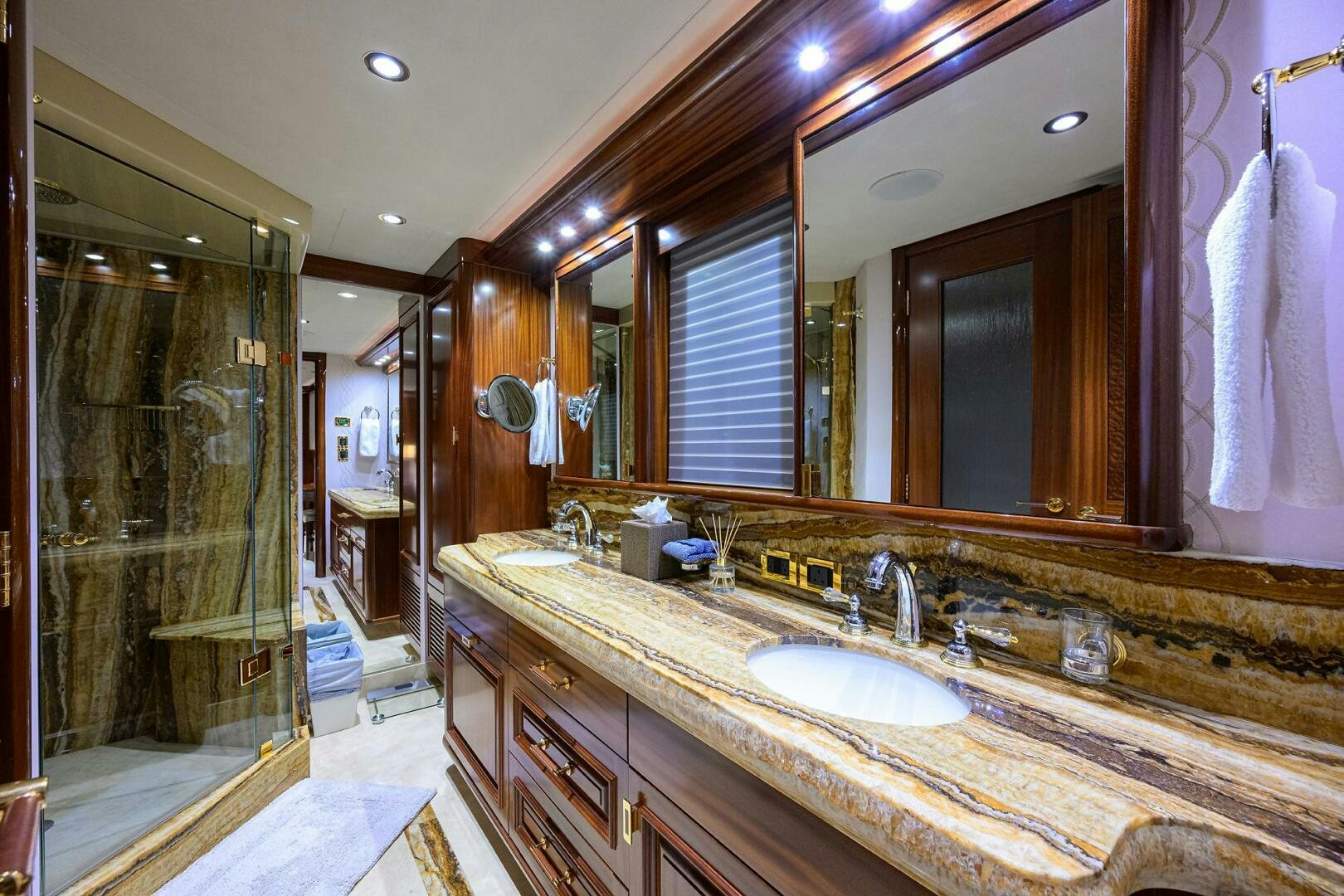 a bathroom with a large mirror aboard SARABETH Yacht for Sale