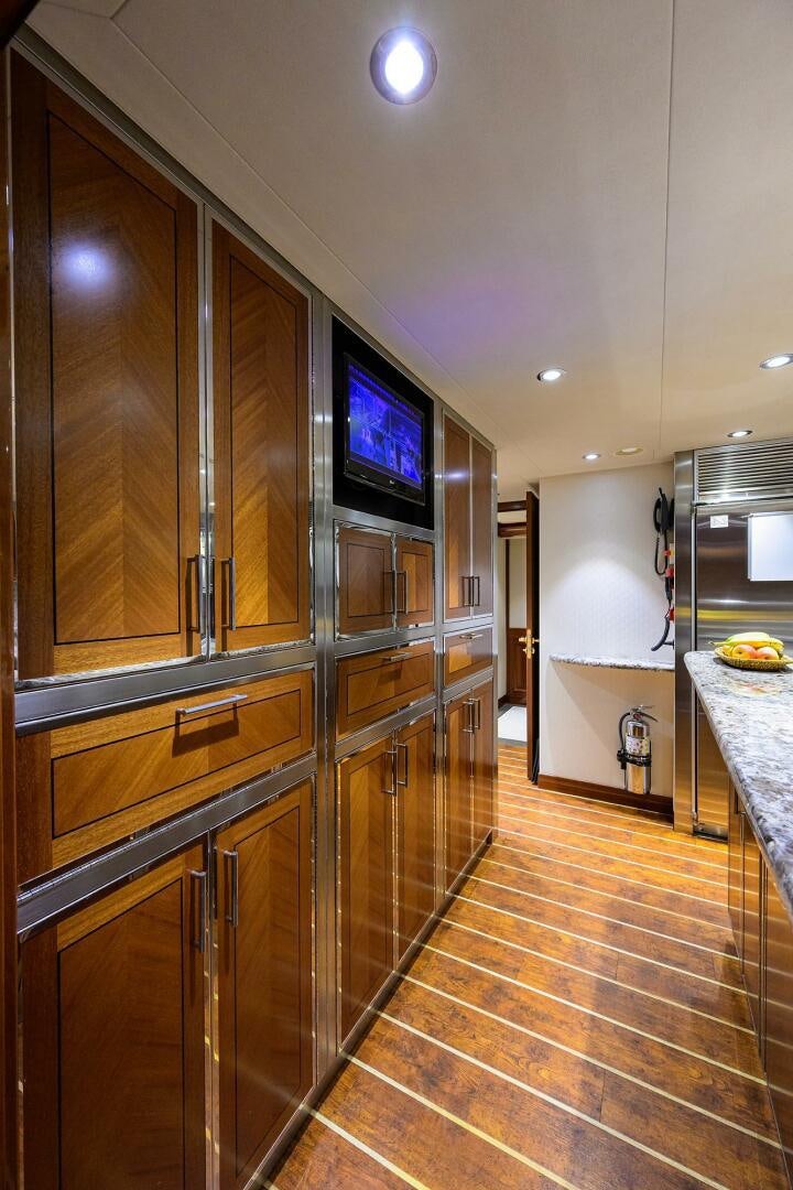 a kitchen with a large glass wall aboard SARABETH Yacht for Sale