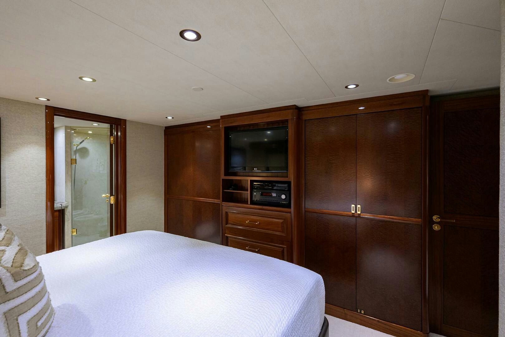a bedroom with a bed and a microwave aboard SARABETH Yacht for Sale