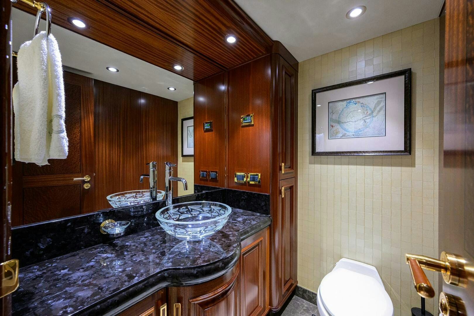 a bathroom with a marble countertop aboard SARABETH Yacht for Sale