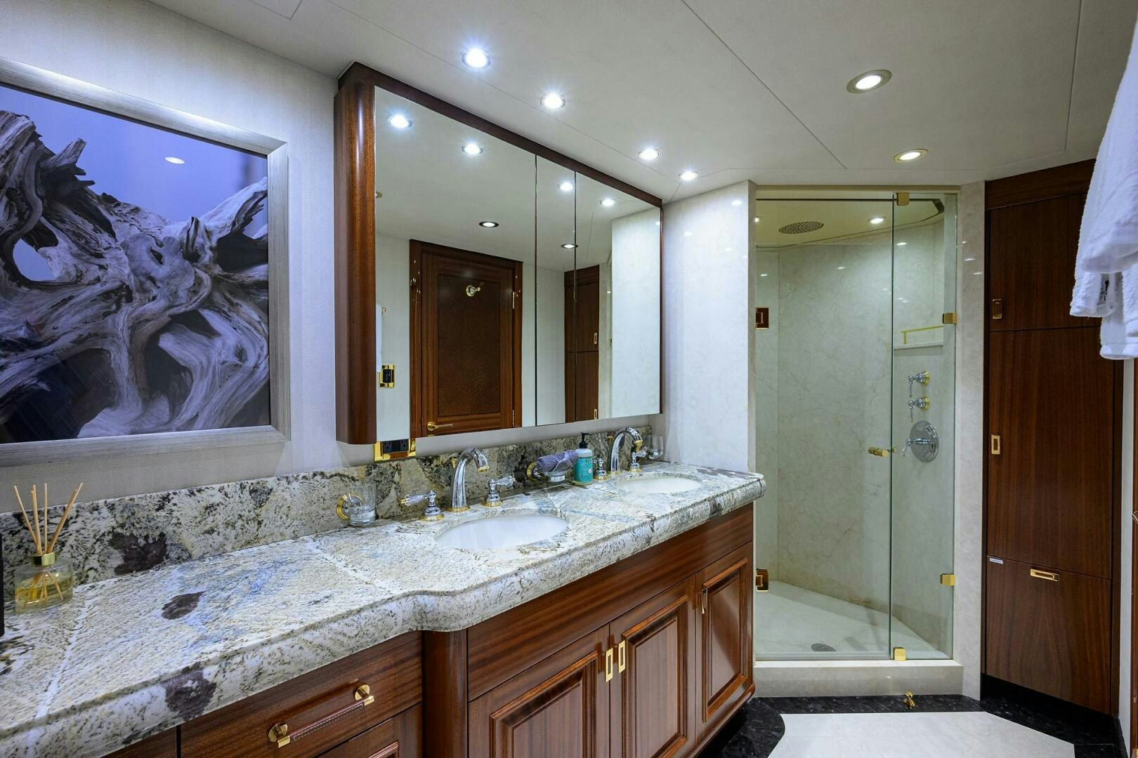 a bathroom with a large mirror aboard SARABETH Yacht for Sale
