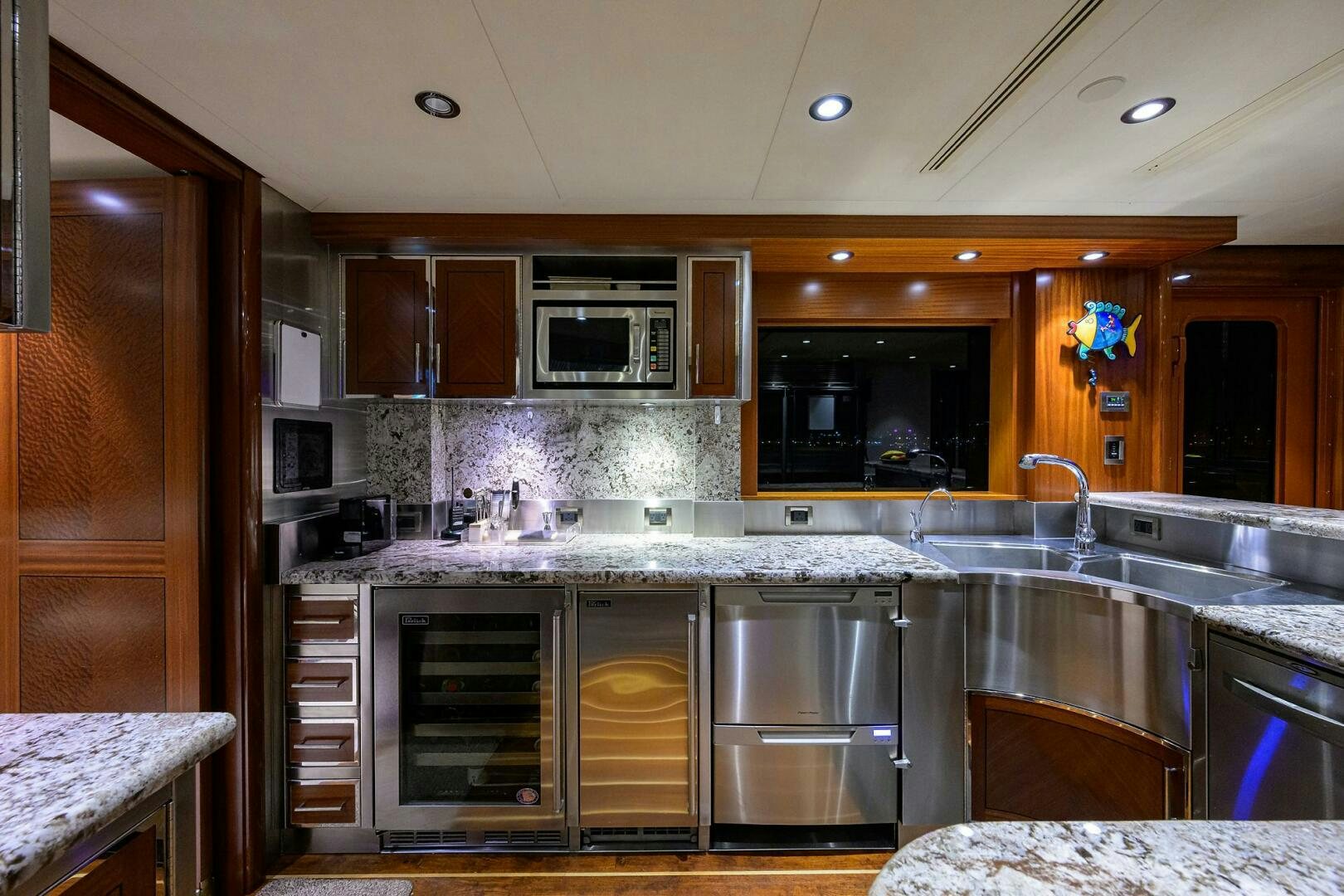 a kitchen with wooden cabinets aboard SARABETH Yacht for Sale