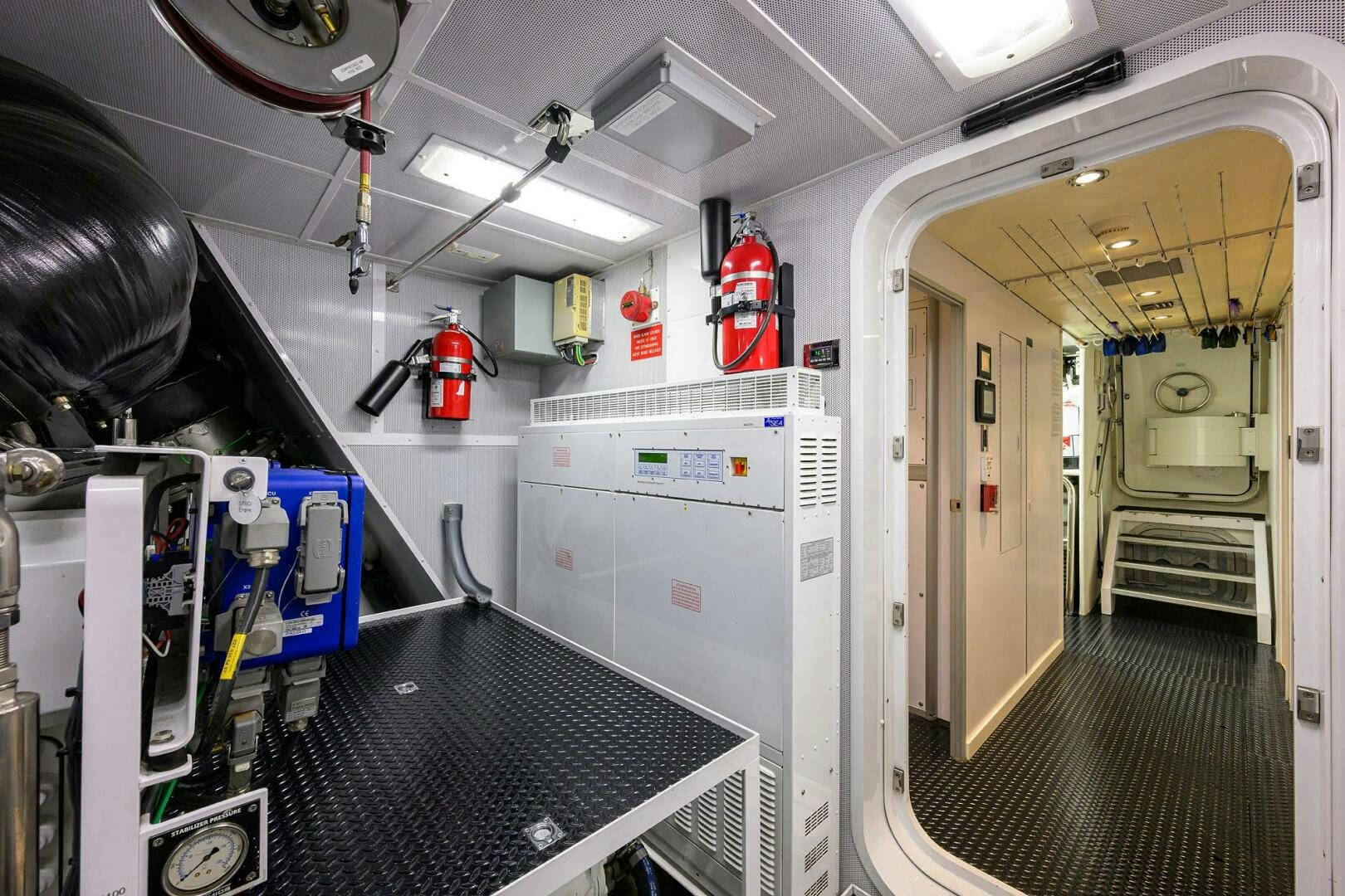 a long hallway with machines aboard SARABETH Yacht for Sale