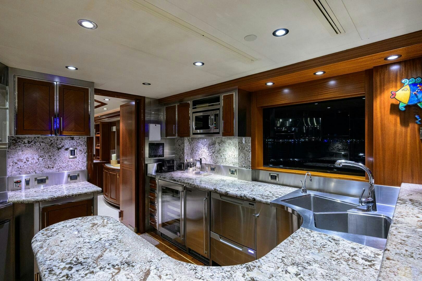 a kitchen with marble counters aboard SARABETH Yacht for Sale