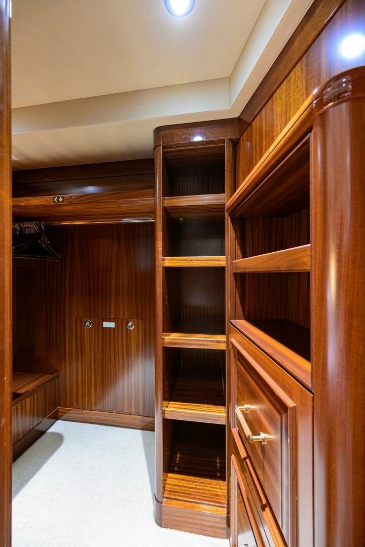 a room with wooden cabinets aboard SARABETH Yacht for Sale