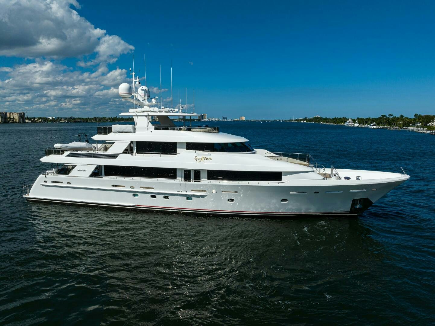 a white yacht on the water aboard SARABETH Yacht for Sale