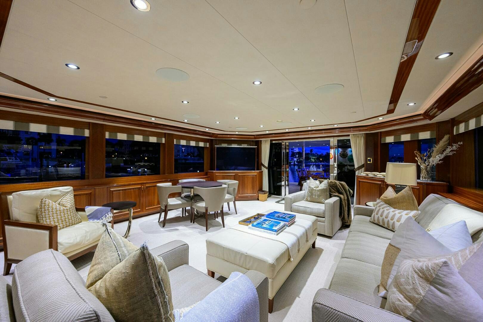 a room with a couch and a table and chairs aboard SARABETH Yacht for Sale