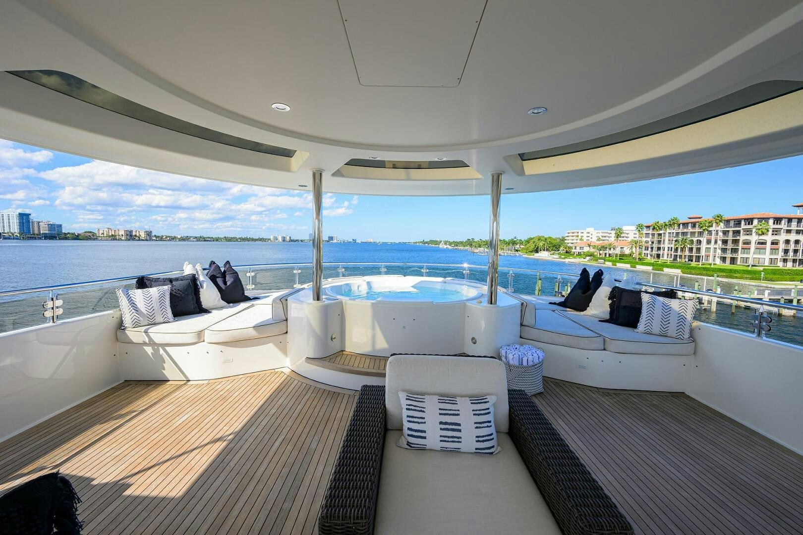 a room with a bed and a large body of water aboard SARABETH Yacht for Sale