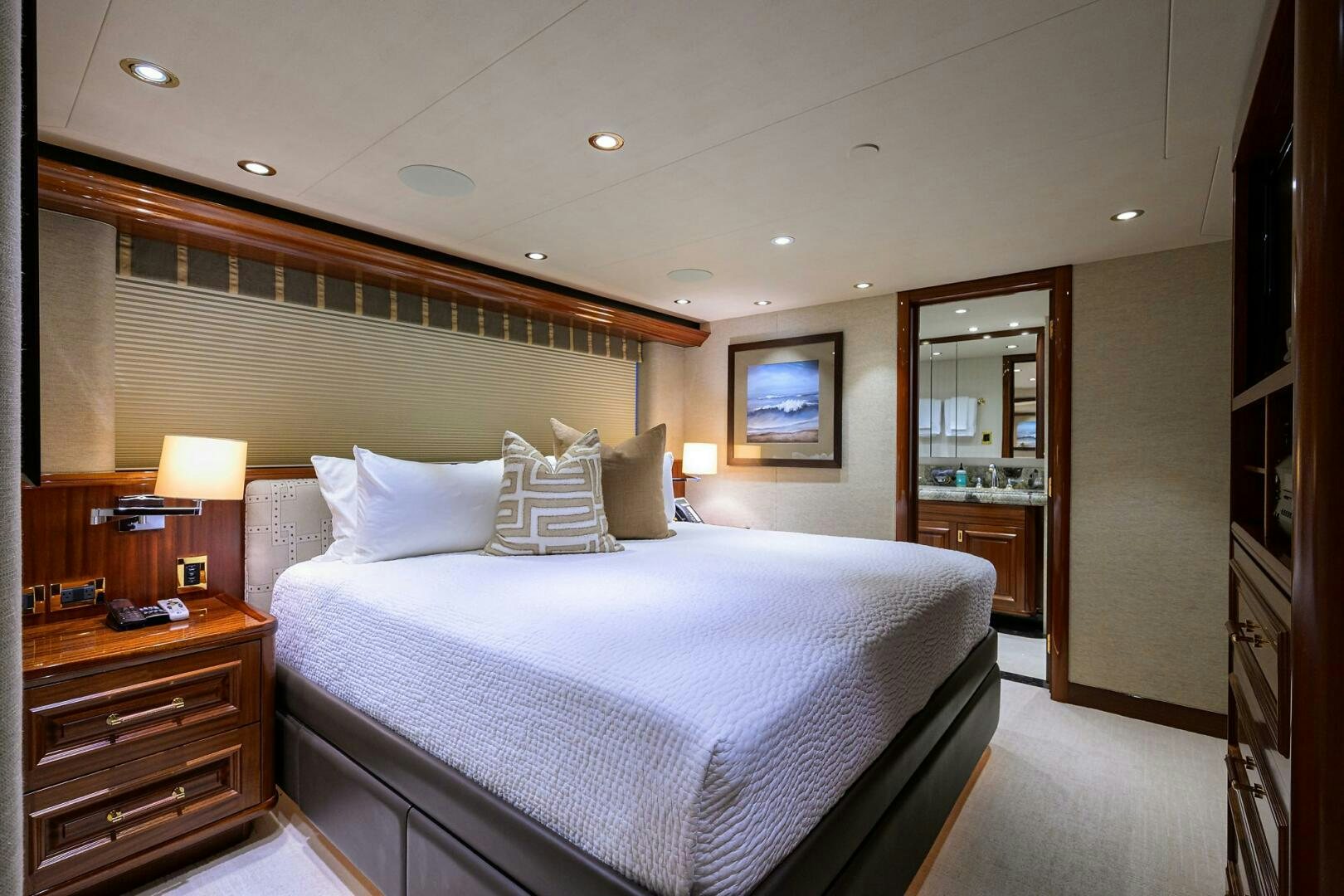 a hotel room with a bed and a mirror aboard SARABETH Yacht for Sale