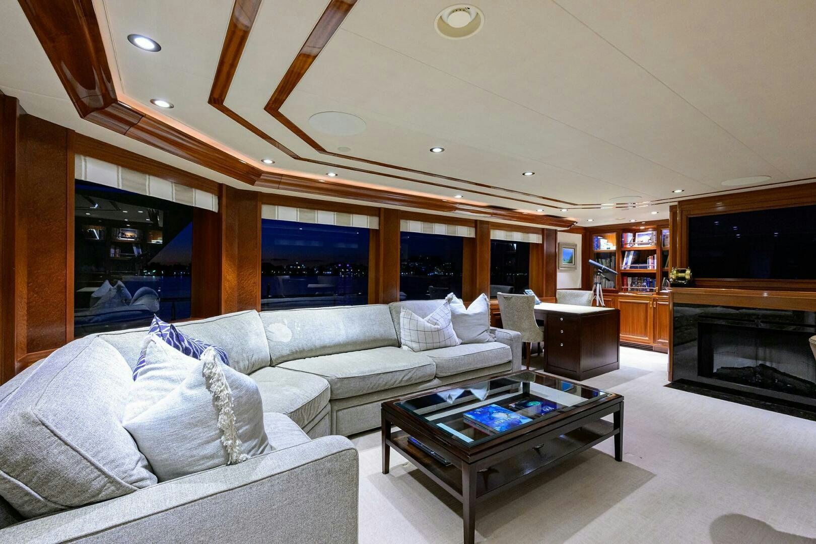 a living room with a fireplace aboard SARABETH Yacht for Sale