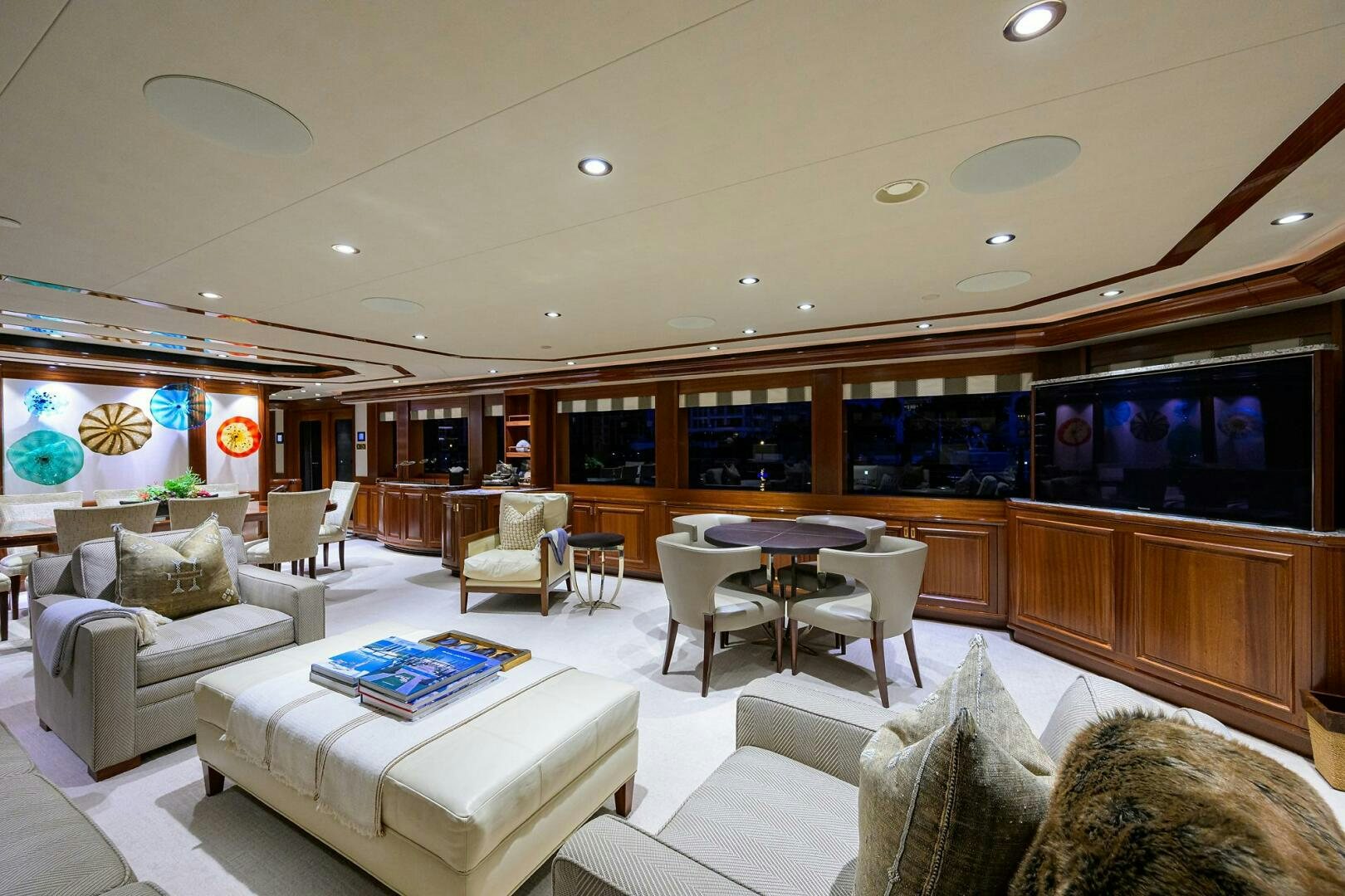 a living room with a large screen aboard SARABETH Yacht for Sale