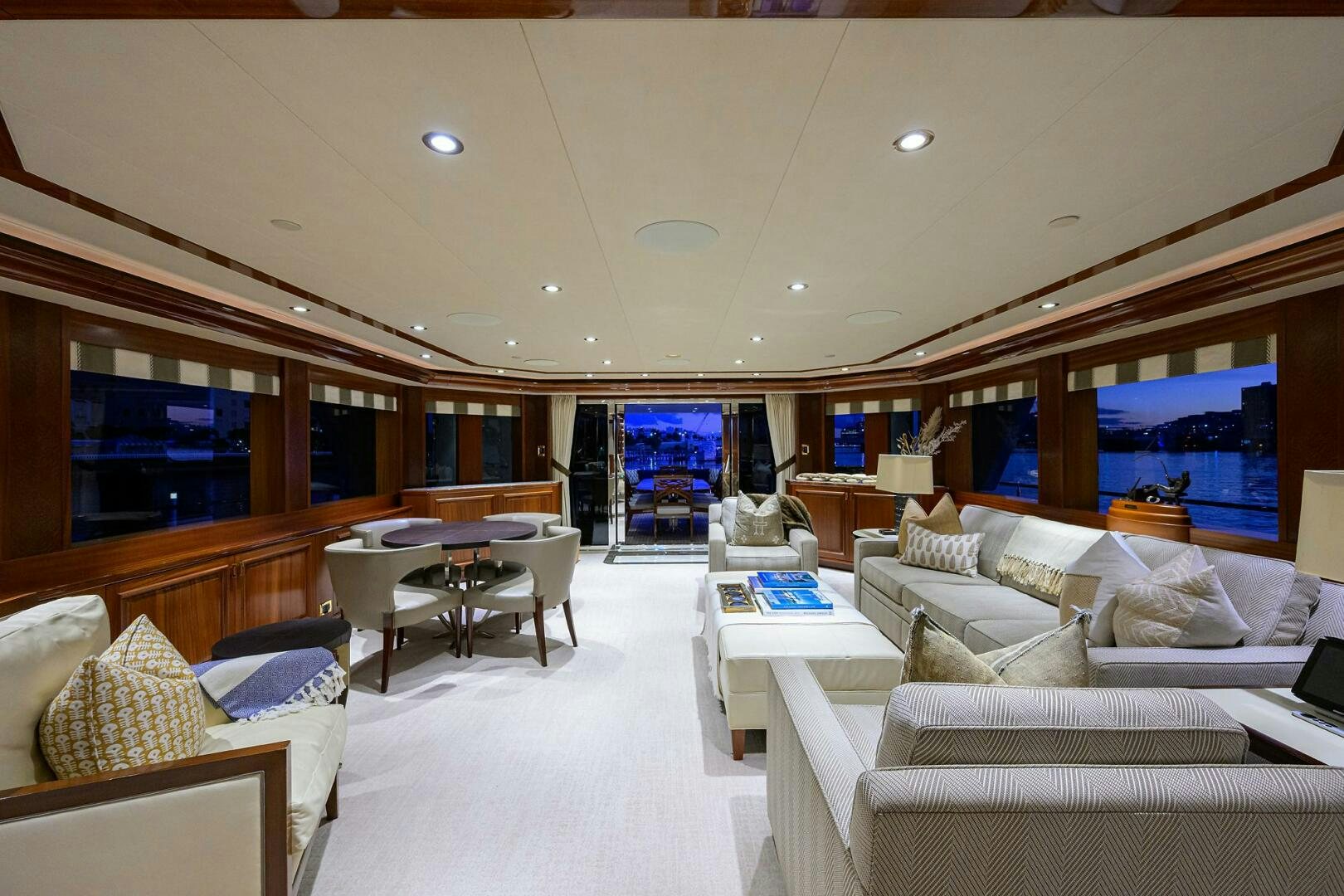 a room with a couch and a table and a window aboard SARABETH Yacht for Sale