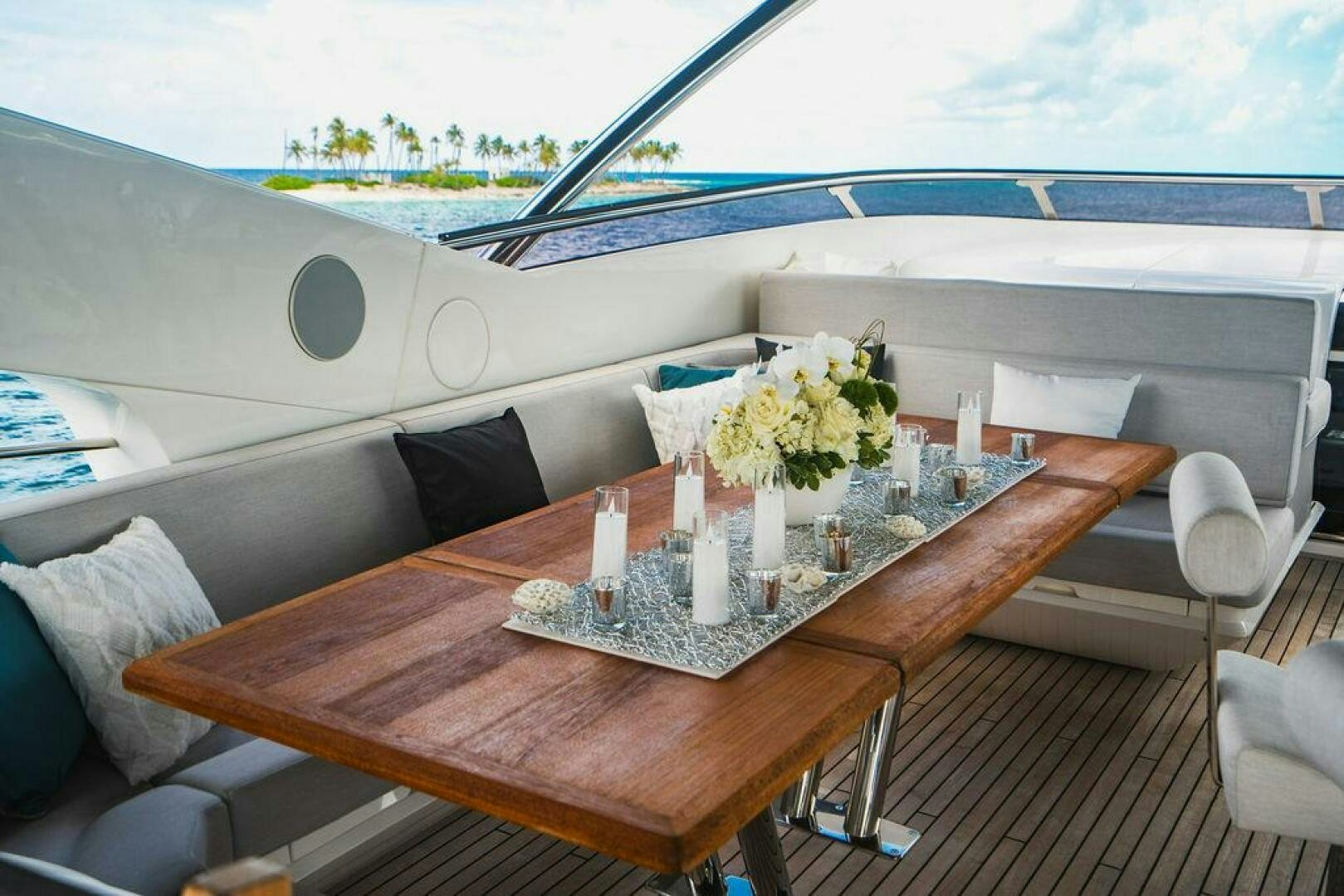 a table with candles on it aboard PURA VIDA Yacht for Sale