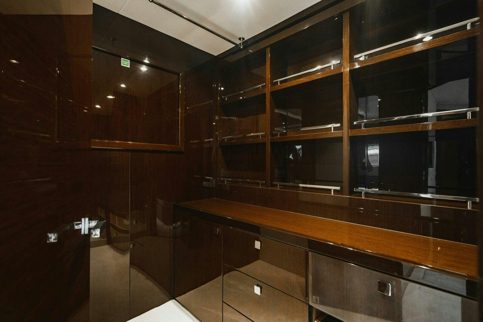a room with cabinets and shelves aboard PURA VIDA Yacht for Sale