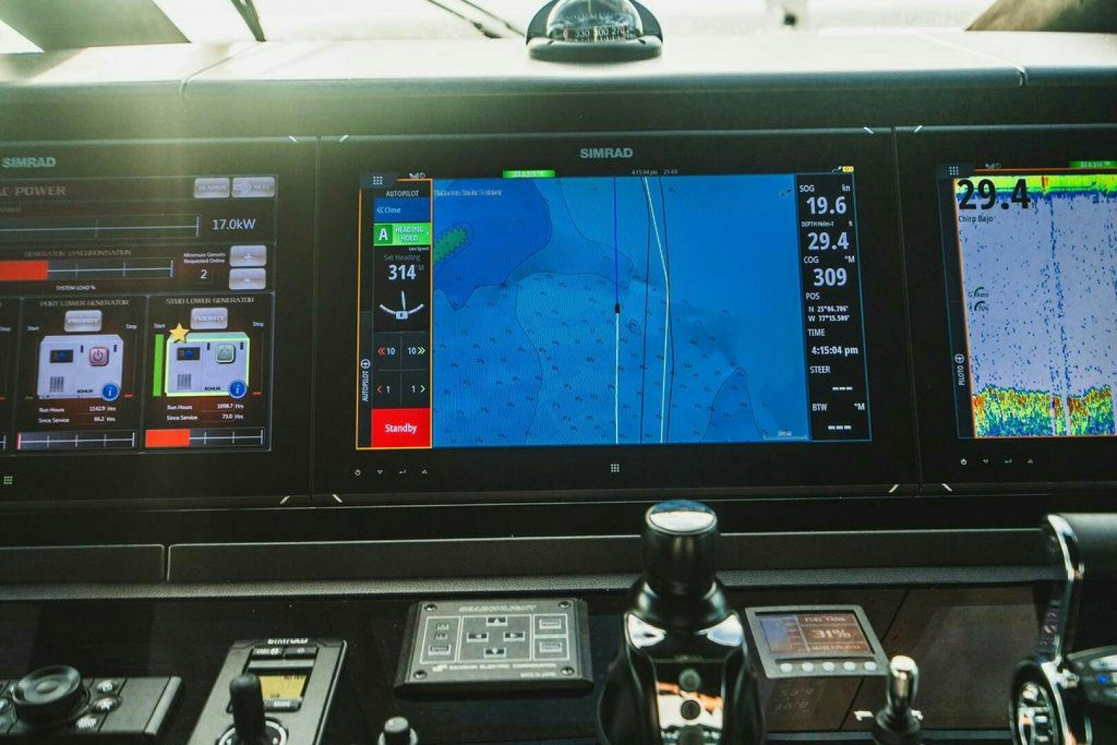 a computer with a screen aboard PURA VIDA Yacht for Sale