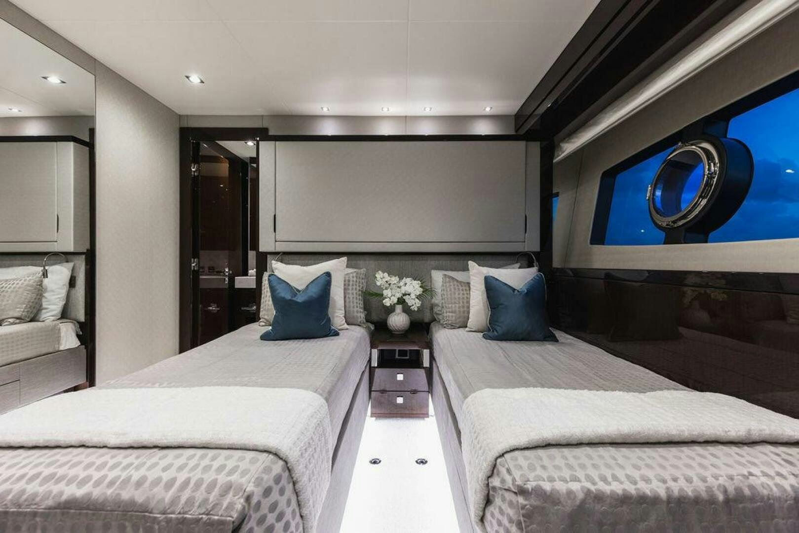 a modern bedroom with a bed aboard PURA VIDA Yacht for Sale