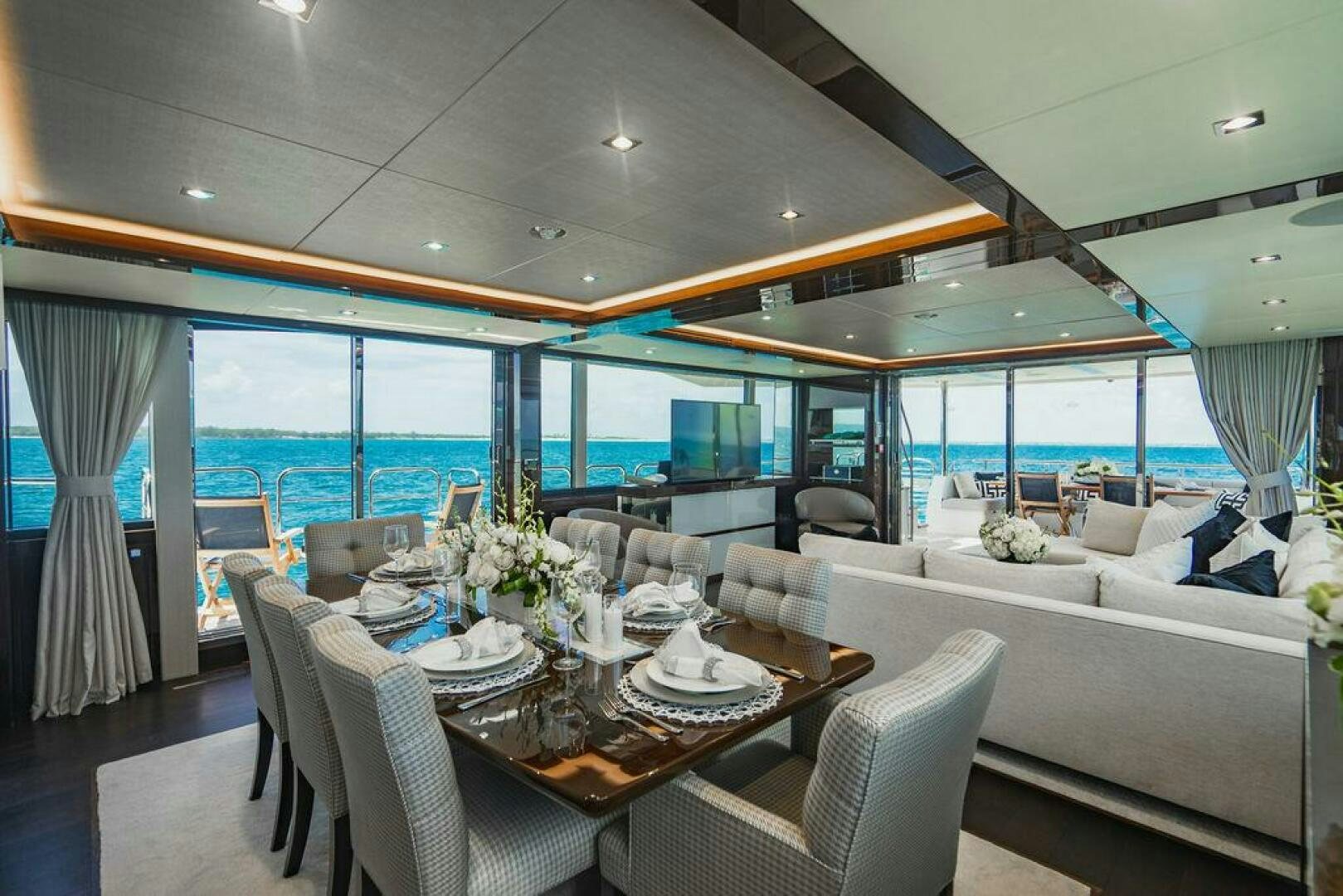 a dining table in a room aboard PURA VIDA Yacht for Sale