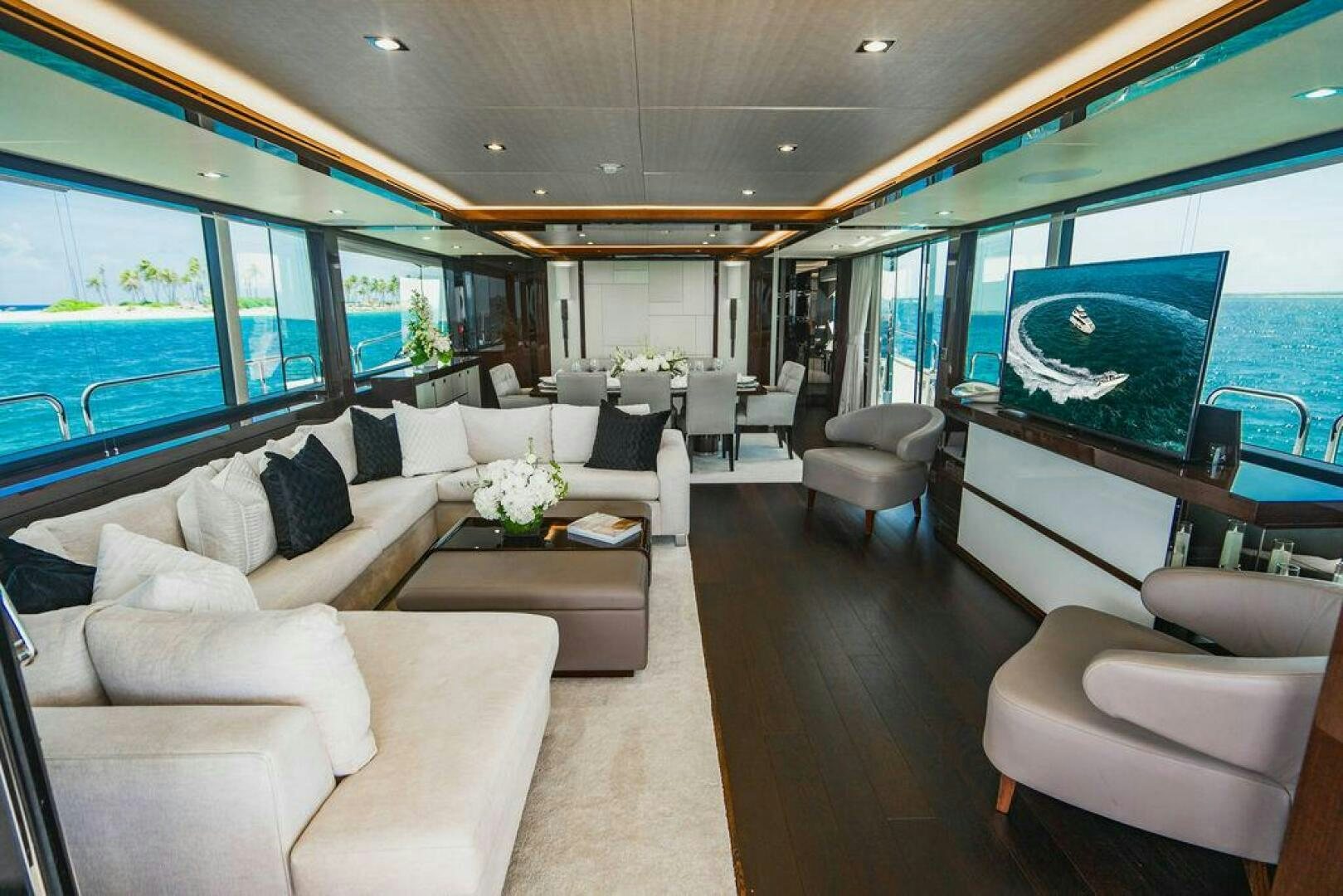 a living room with a large window aboard PURA VIDA Yacht for Sale