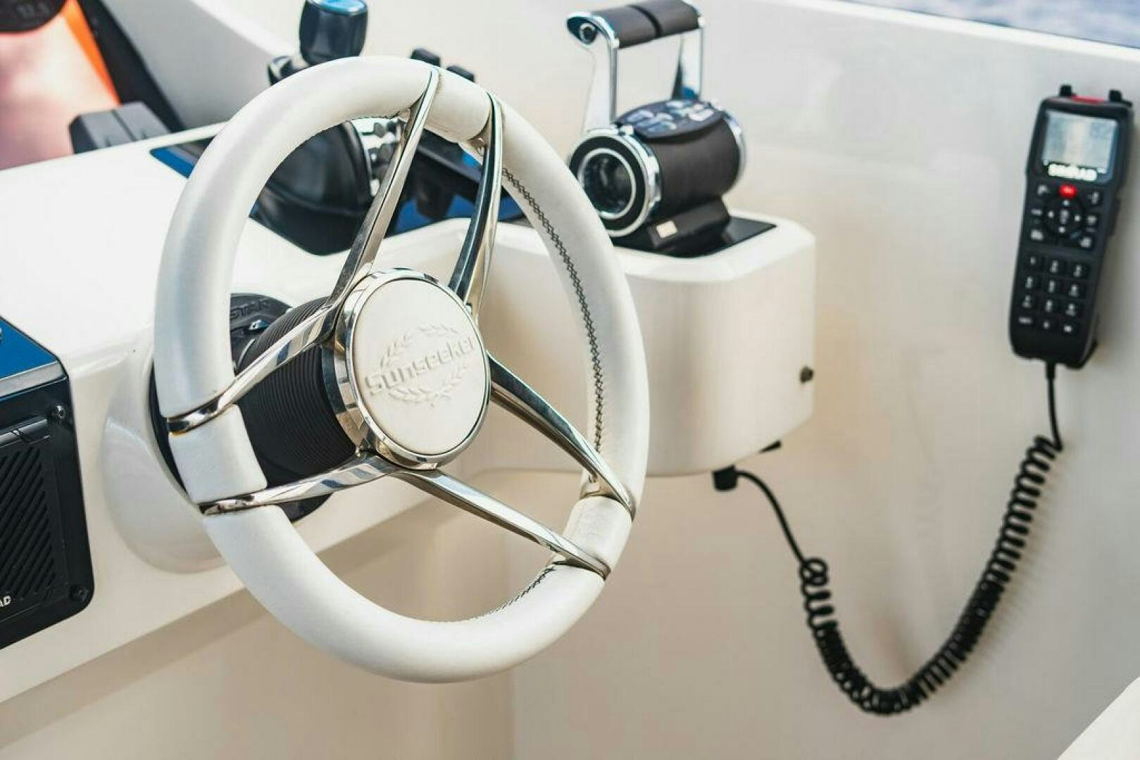 a white headphone with a cord aboard PURA VIDA Yacht for Sale