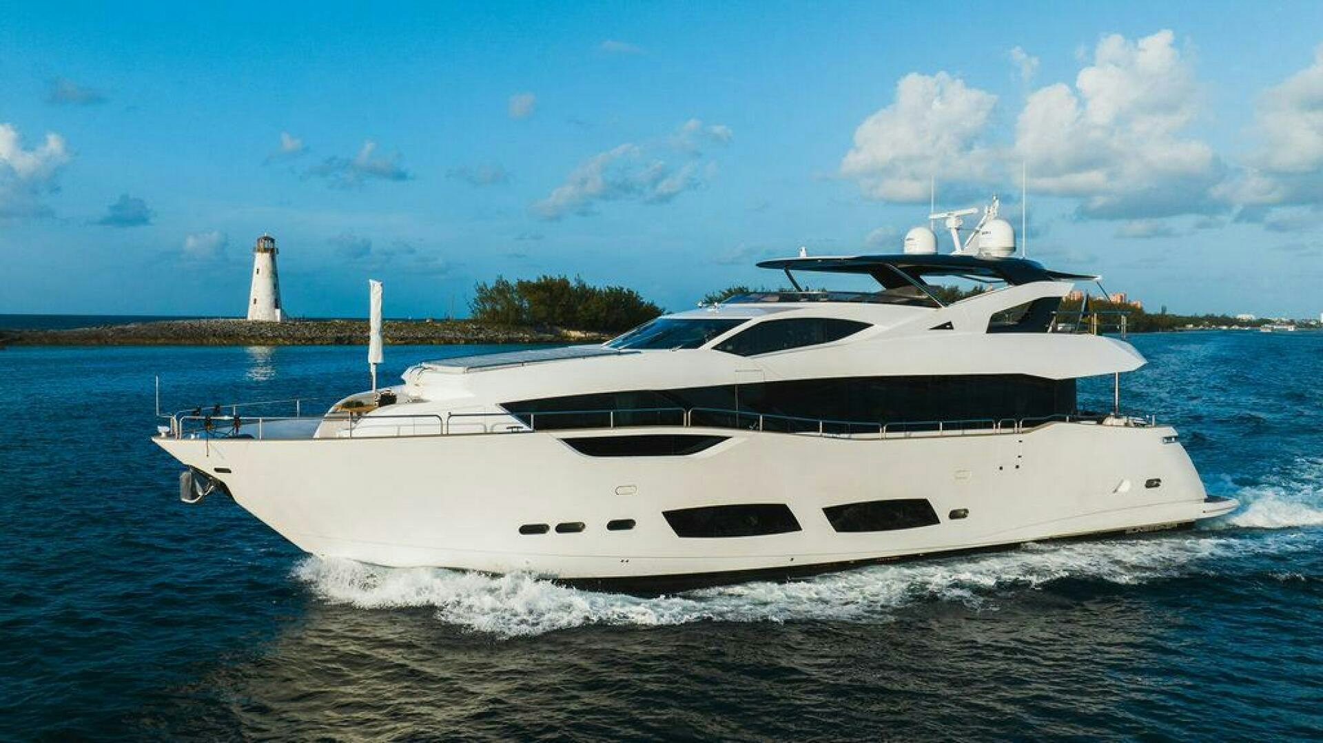 a white yacht on the water aboard PURA VIDA Yacht for Sale