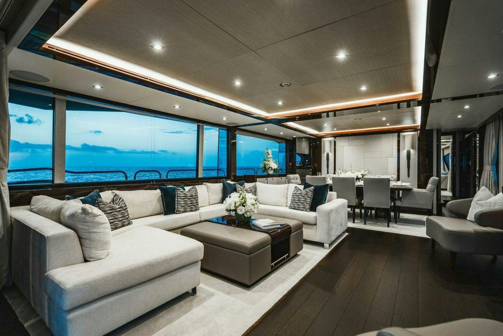 a living room with a large window aboard PURA VIDA Yacht for Sale
