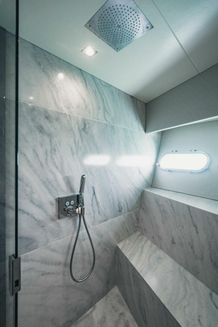 a bathroom with a sink and a mirror aboard PURA VIDA Yacht for Sale