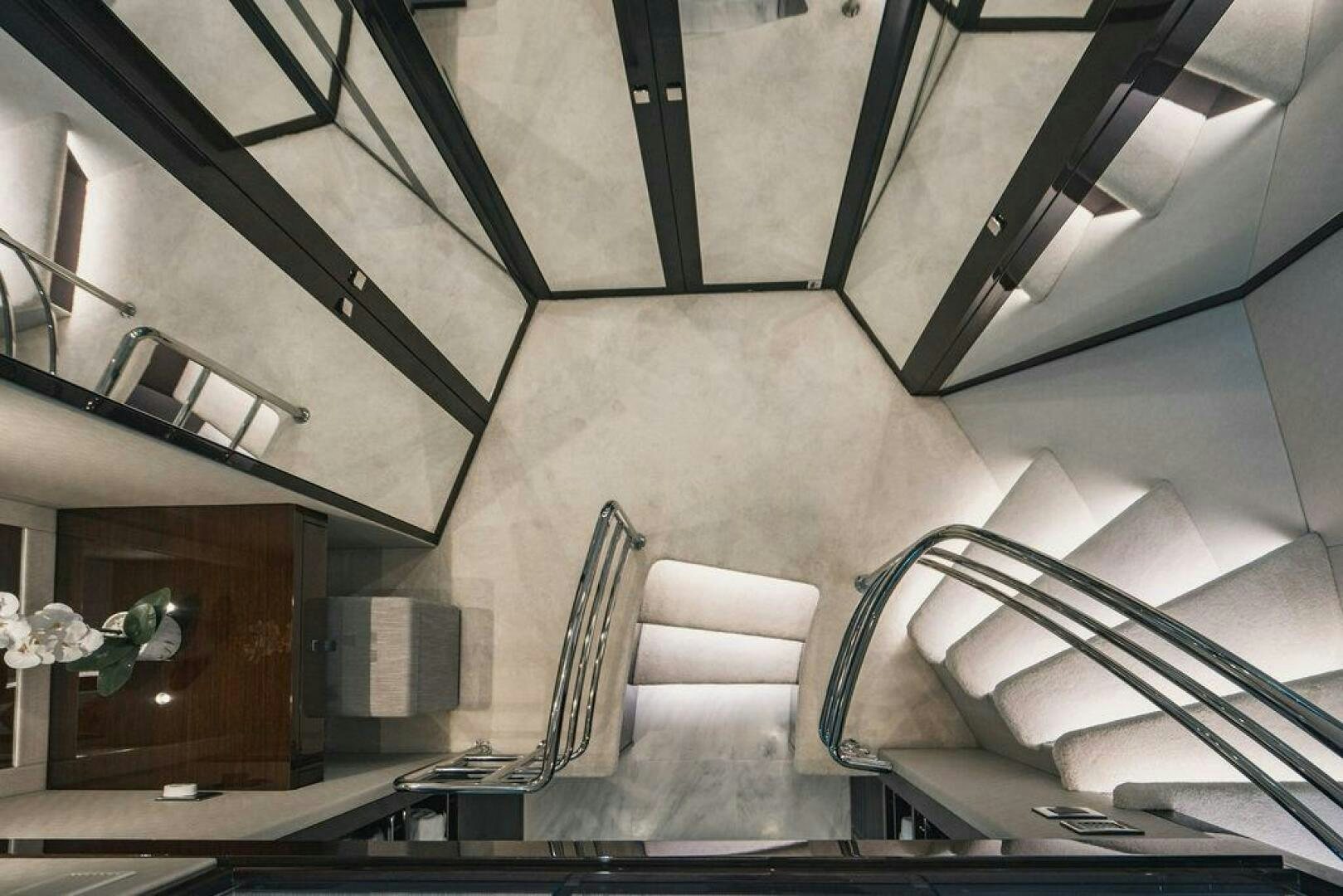 a set of chairs on a balcony aboard PURA VIDA Yacht for Sale