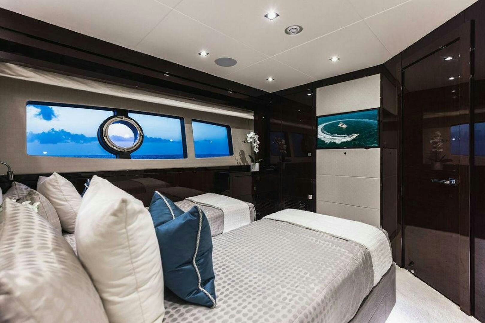 a bed in a room aboard PURA VIDA Yacht for Sale