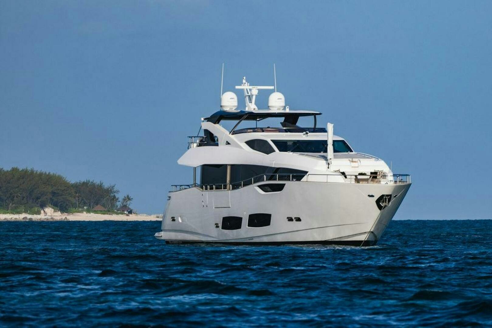 a white yacht on the water aboard PURA VIDA Yacht for Sale