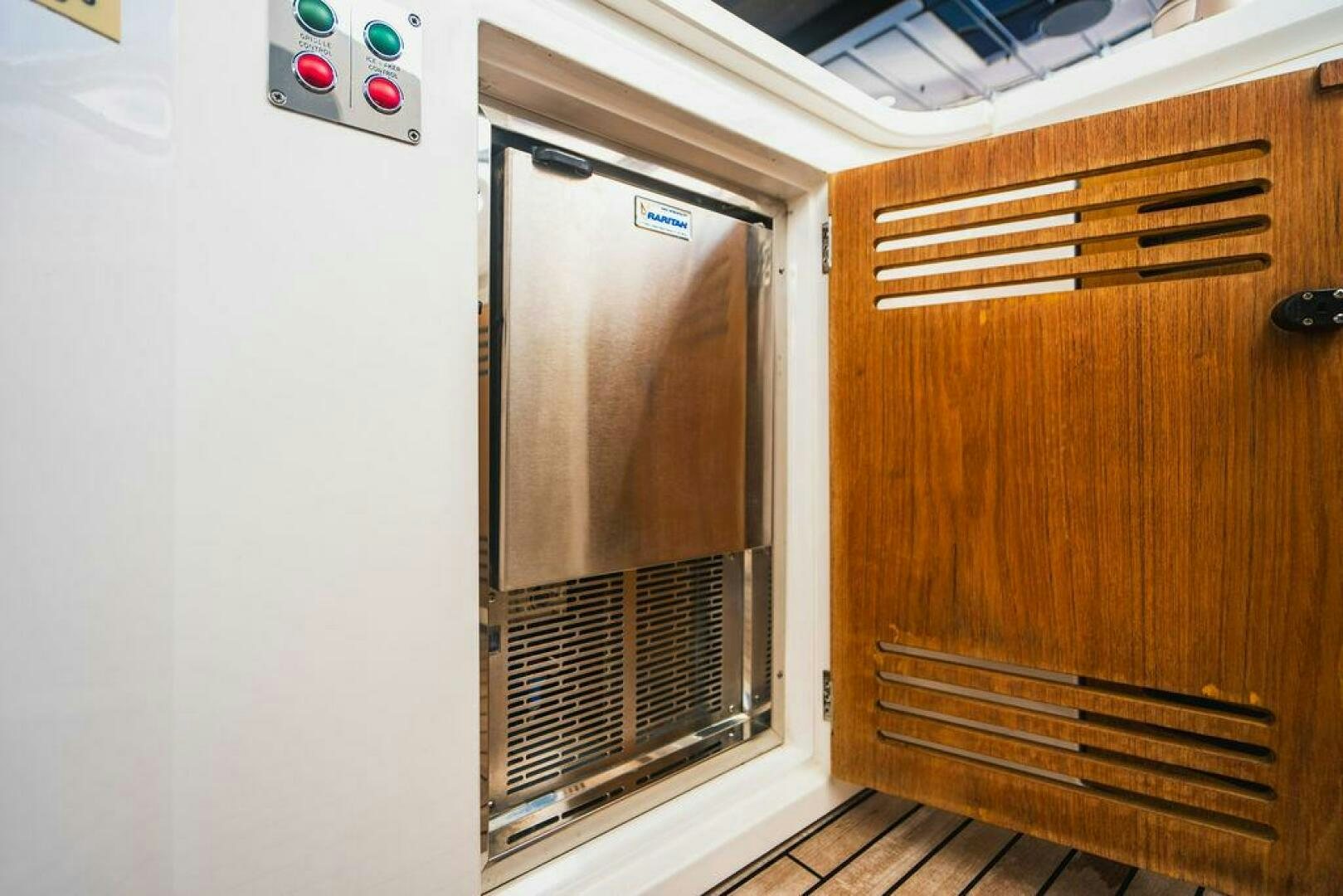 a refrigerator in a kitchen aboard PURA VIDA Yacht for Sale