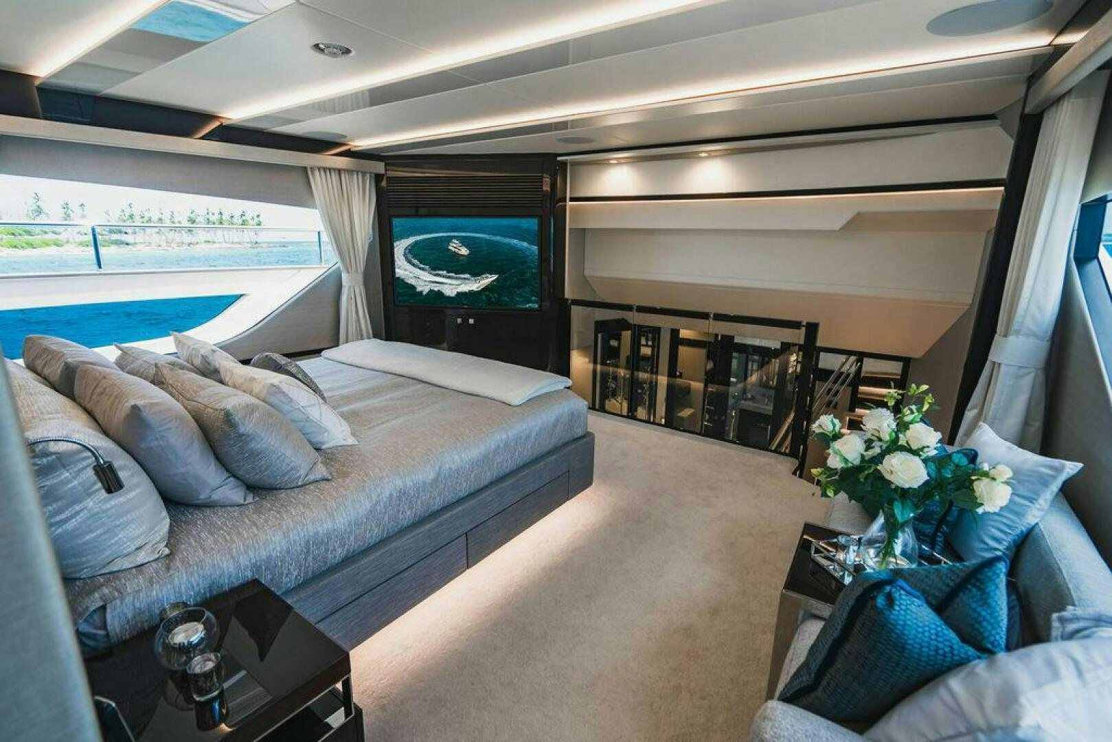 a room with a couch and a television aboard PURA VIDA Yacht for Sale