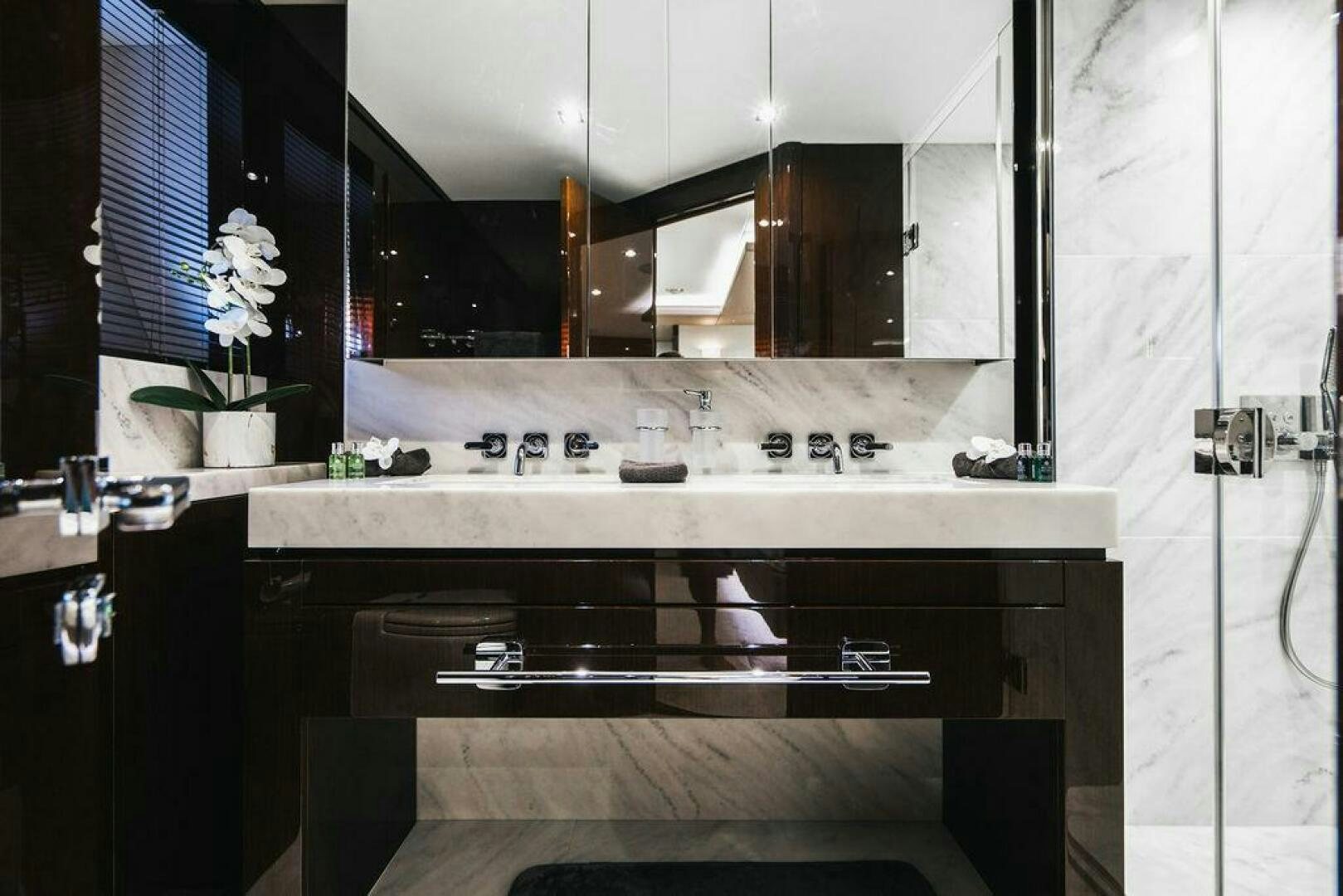 a kitchen with a sink and cabinets aboard PURA VIDA Yacht for Sale