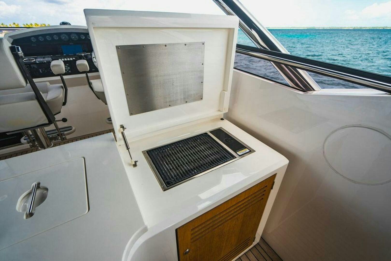 a white microwave on a boat aboard PURA VIDA Yacht for Sale